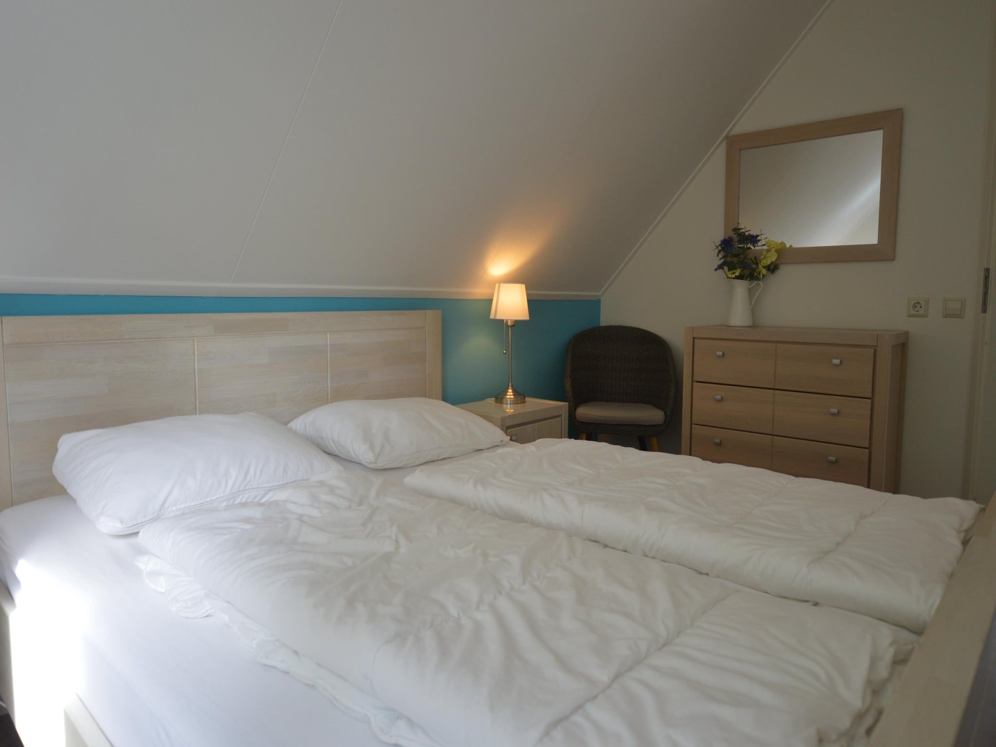 Een slaapkamer van Buitenplaats Berg en Bos nummer 15 in Lemele