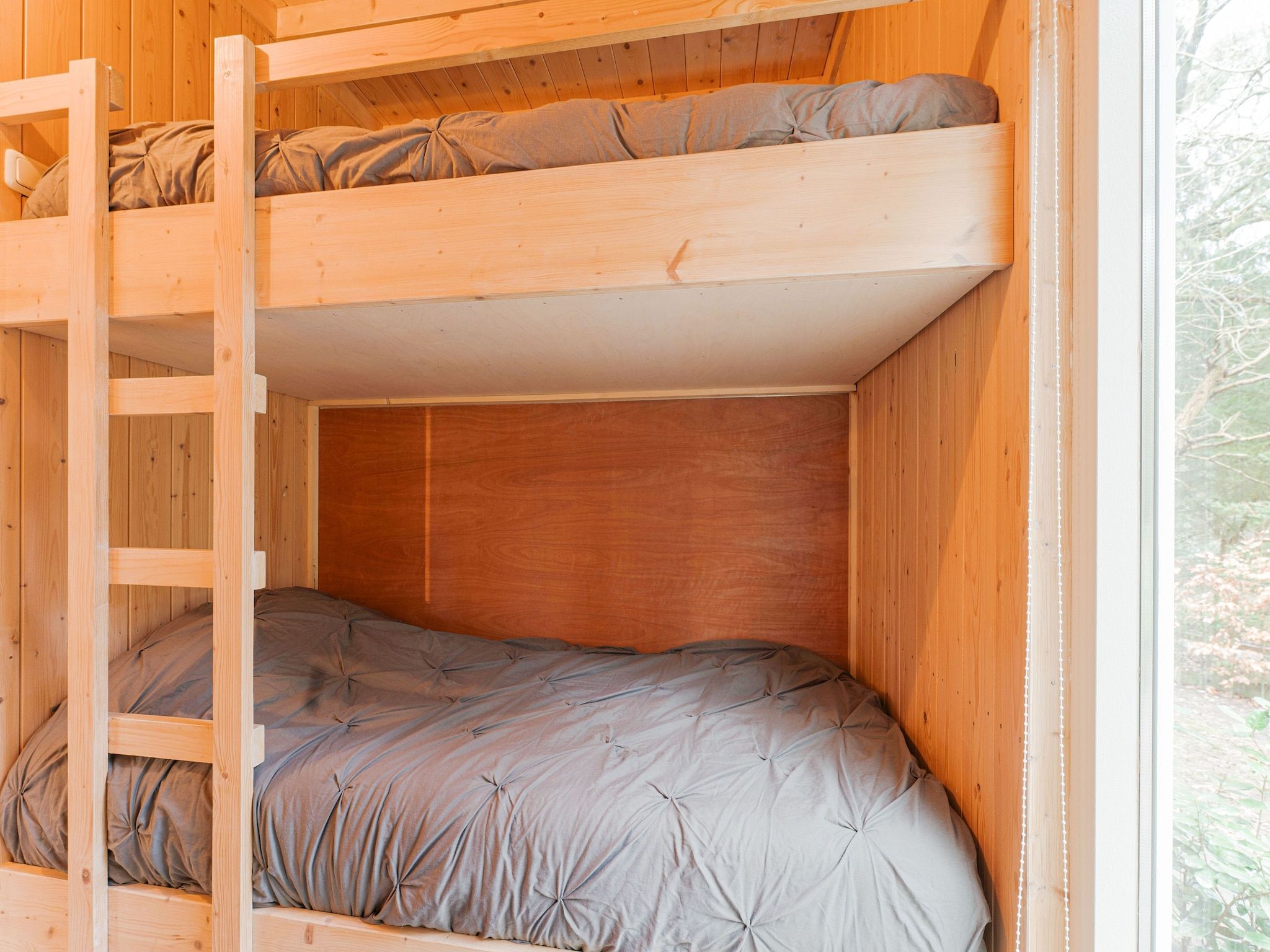 Een slaapkamer van Boshuis De Klim in Norg