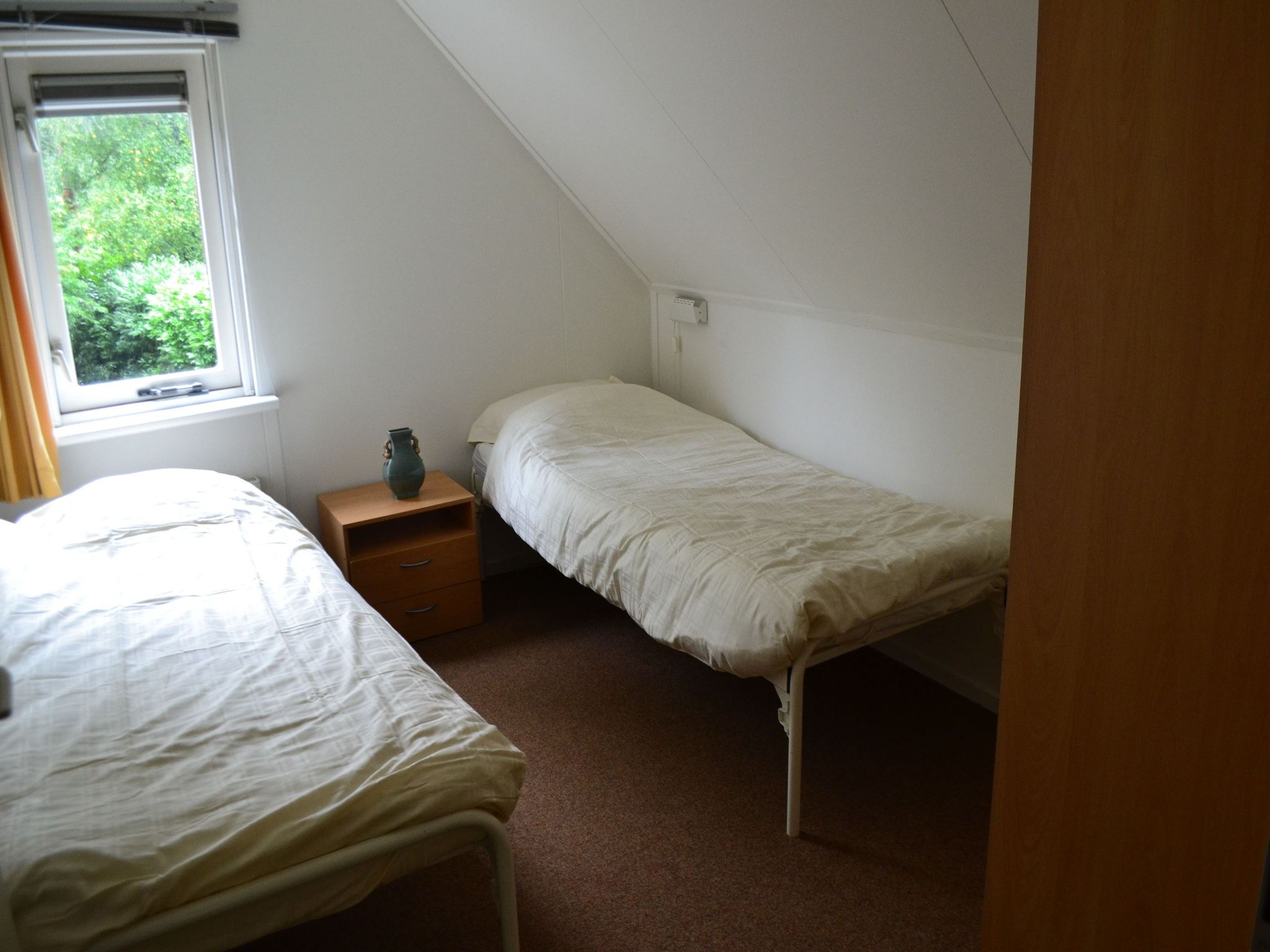 Een slaapkamer van Buitenplaats Berg en Bos nummer 4 in Lemele