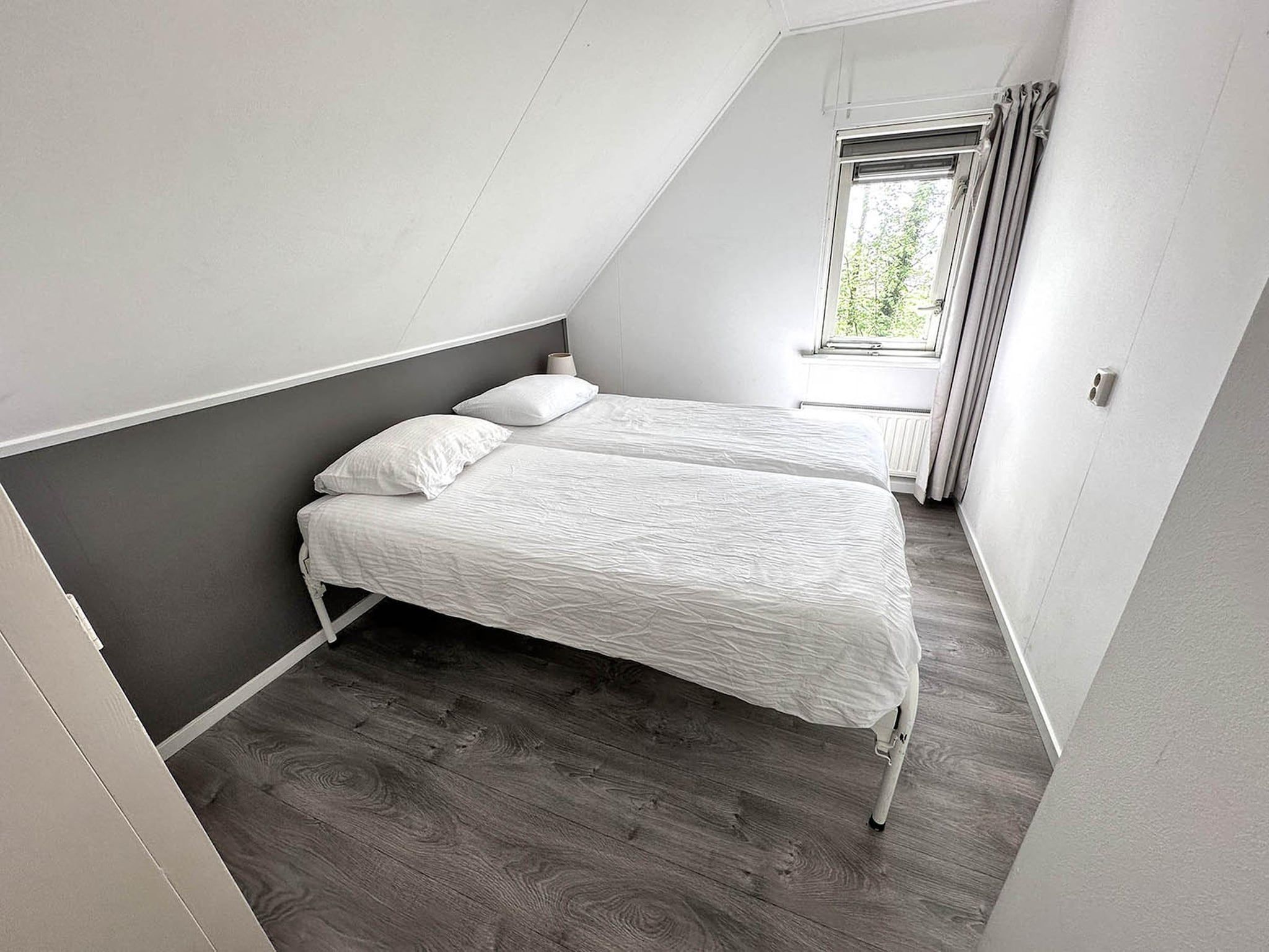 Een slaapkamer van Buitenplaats Berg en Bos nummer 4 in Lemele