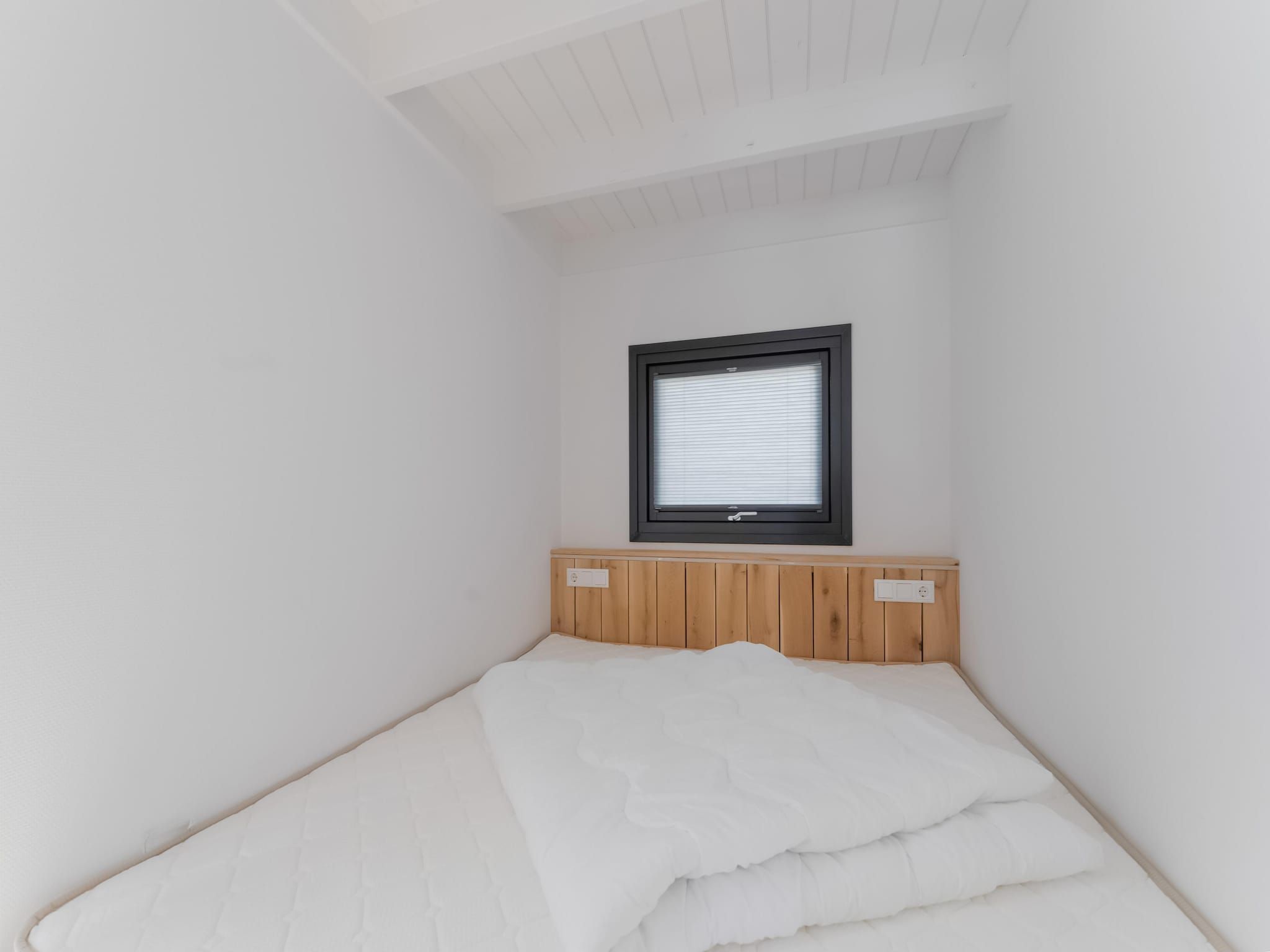 Een slaapkamer van Boat House Stavoren in Stavoren