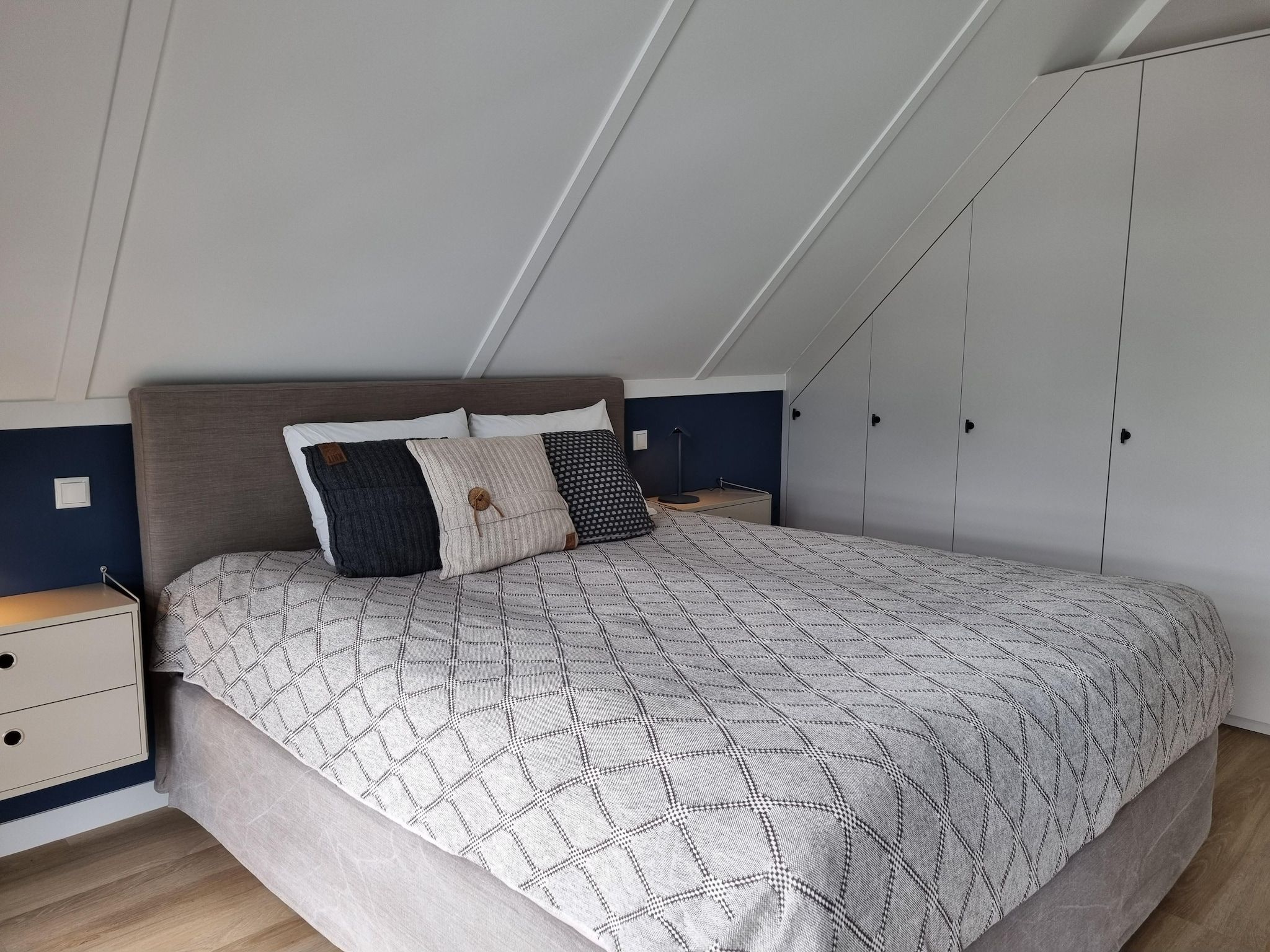 Een slaapkamer van Watervilla Acht in Balk