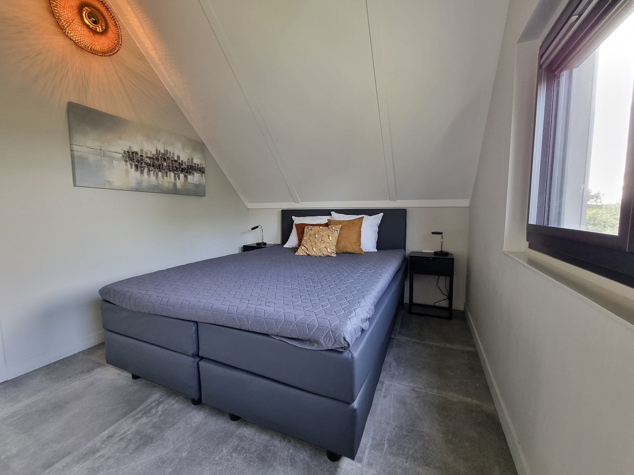 Een slaapkamer van Watervilla Fjirtjin in Balk