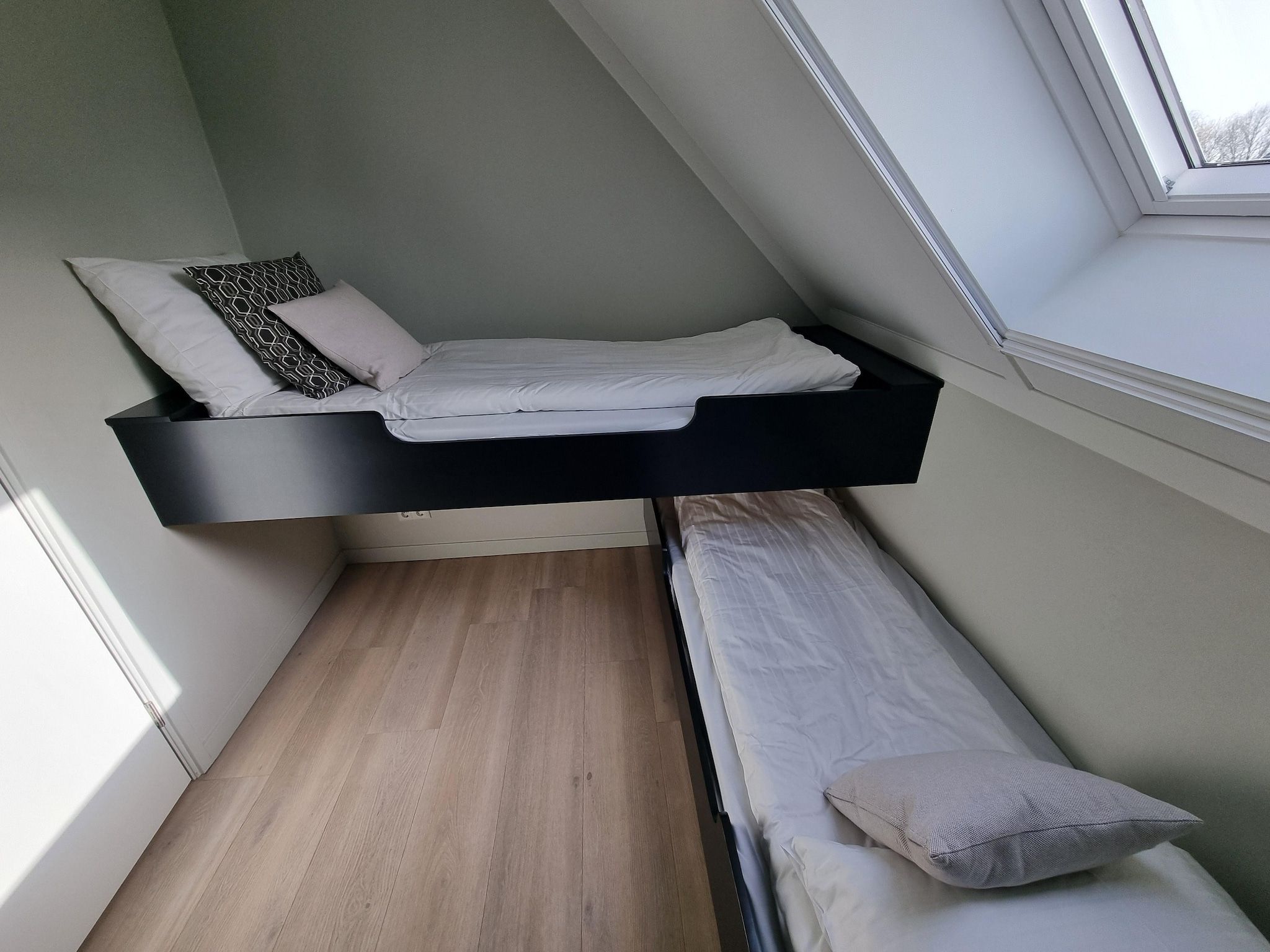 Een slaapkamer van Watervilla Achttjin in Balk