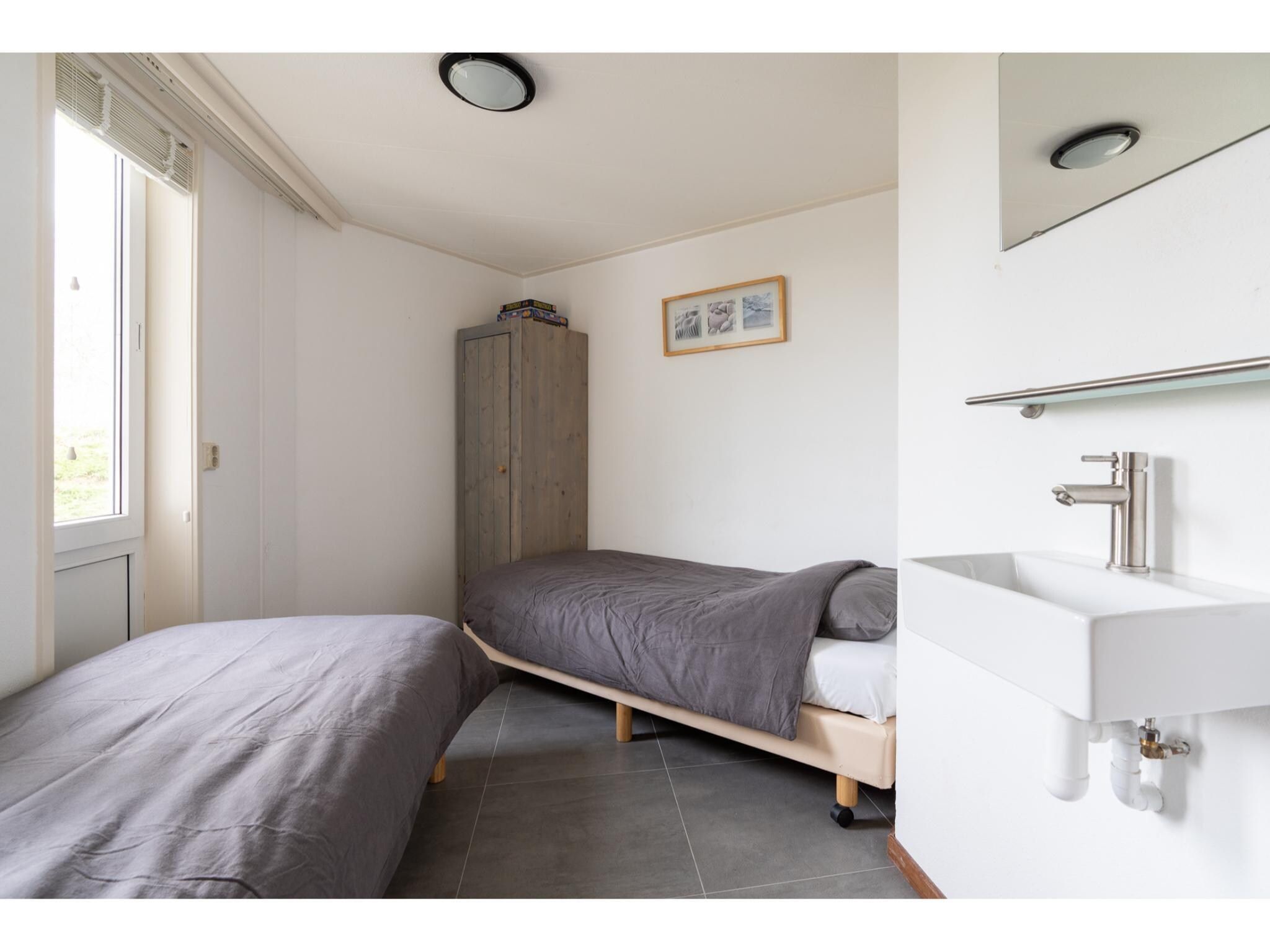 Een slaapkamer van Golfvilla 39 Wellness in Hollum