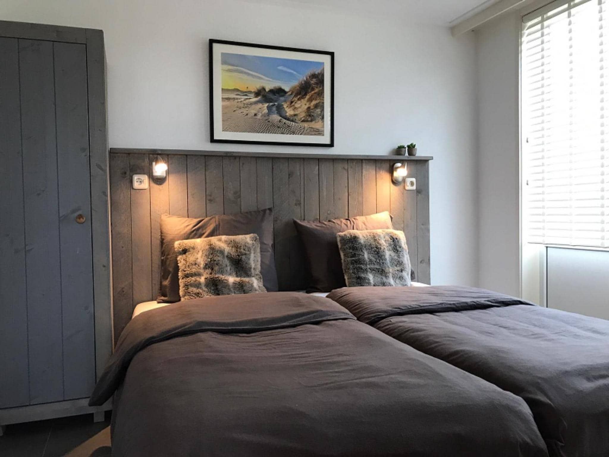 Een slaapkamer van Golfvilla 39 Wellness in Hollum