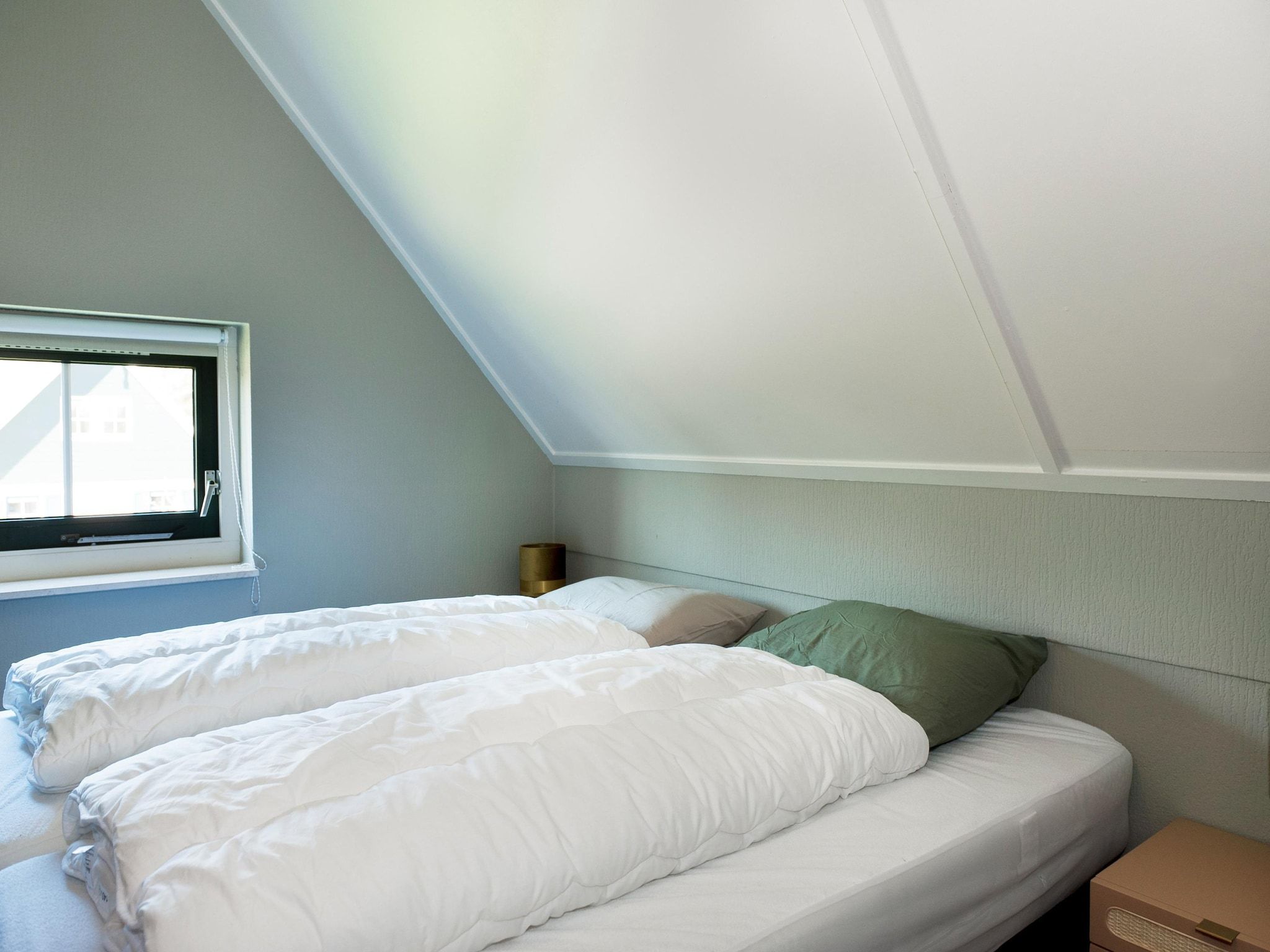 Een slaapkamer van 12 pers Lethehuis met sauna buitenspa en toerboot in Vlagtwedde