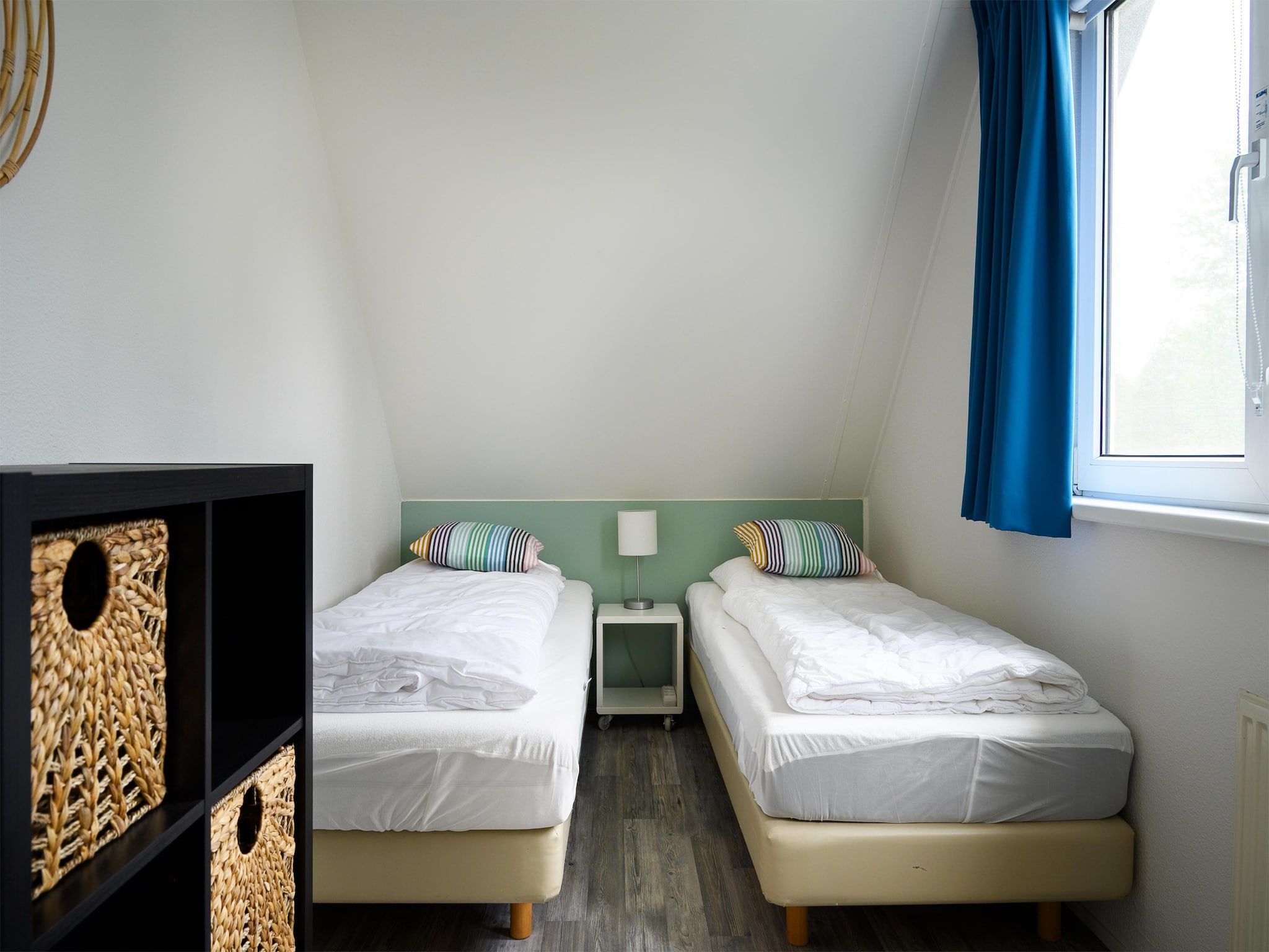 Een slaapkamer van 8 pers Westerwolde Prestige Welness met buitenspa in Vlagtwedde