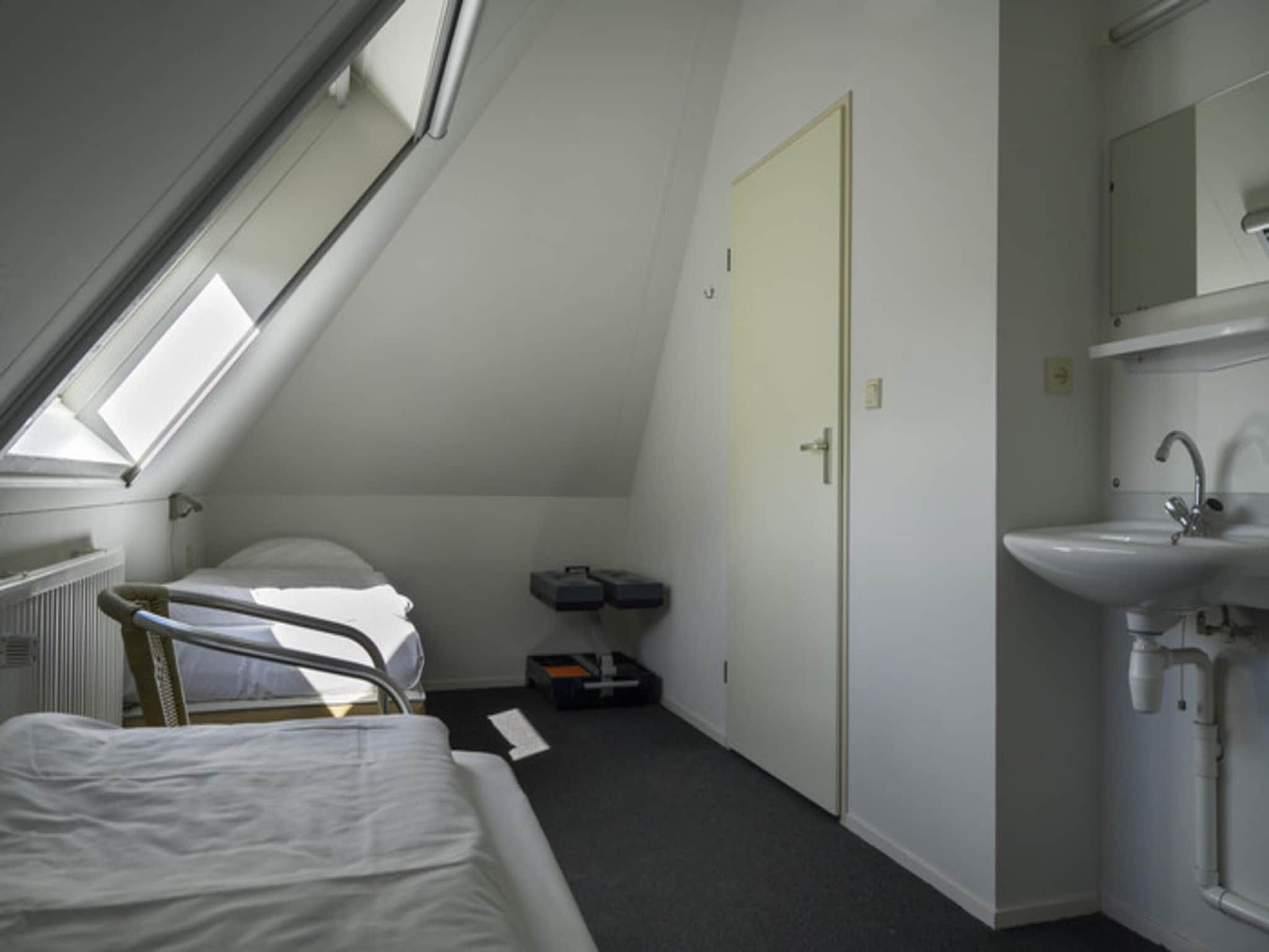 Een slaapkamer van Skip Wellness de luxe met sauna in Friesland