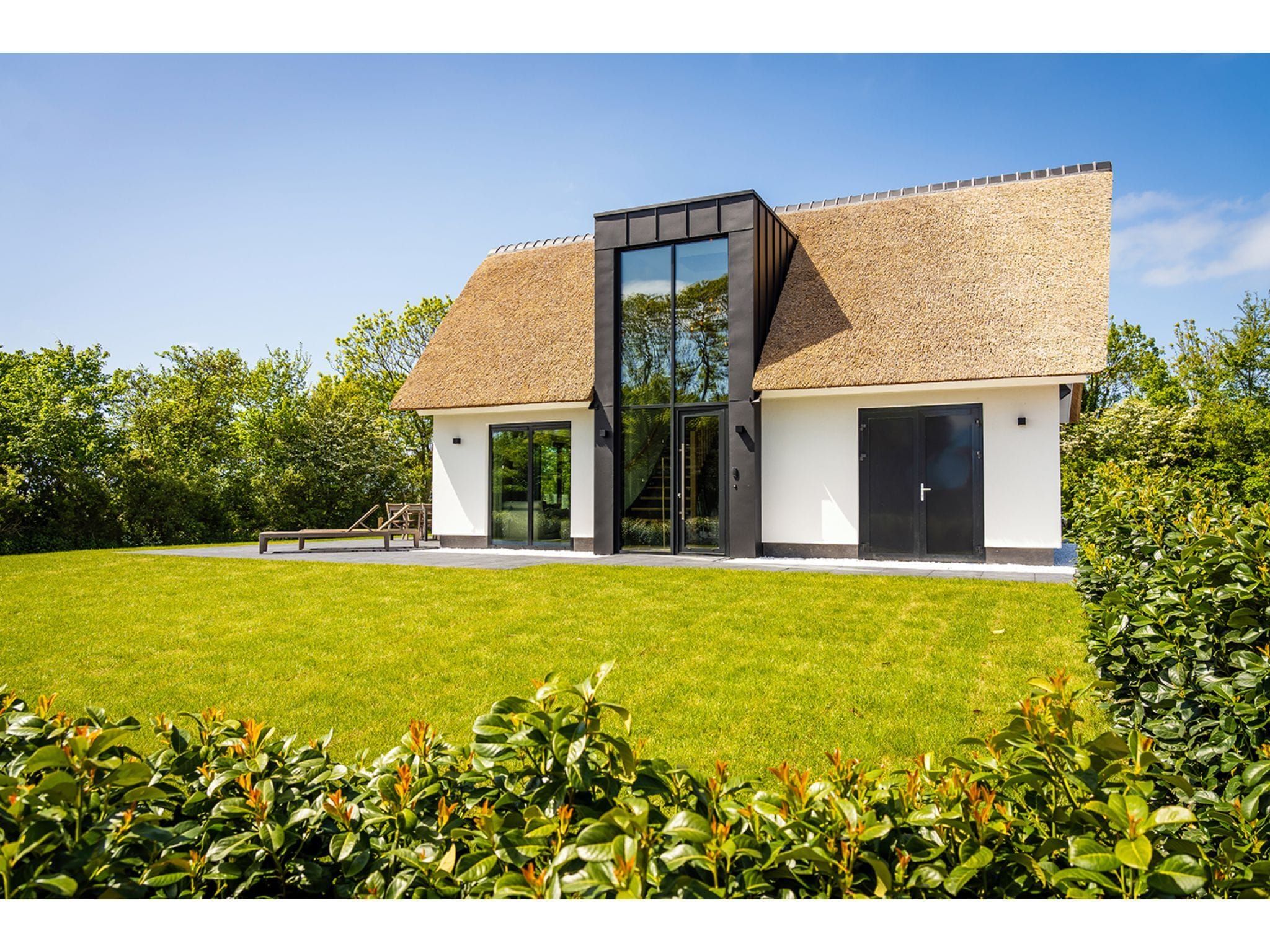 De tuin van Type N Luxe Villa Zeeburg in De Cocksdorp
