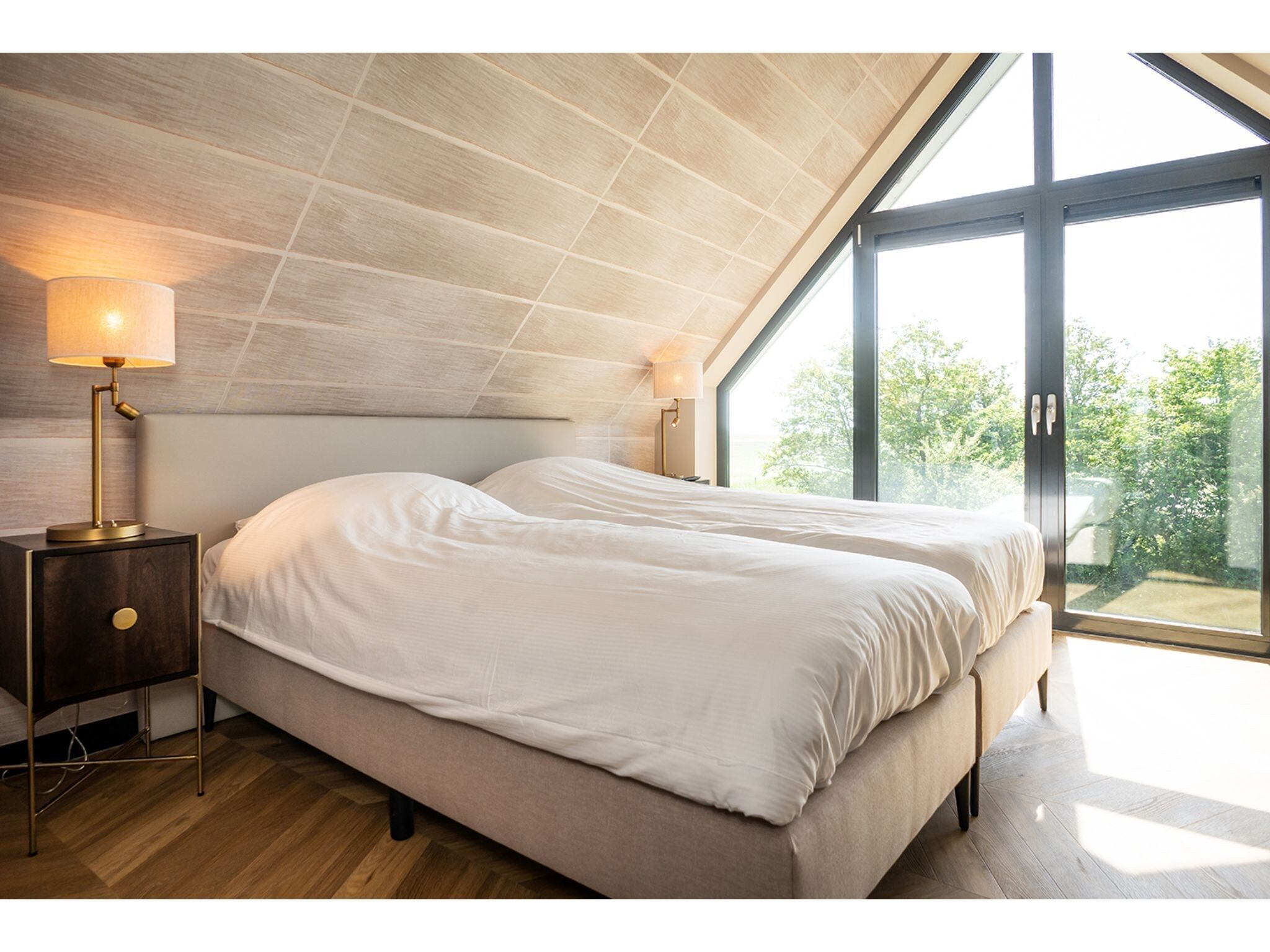 Een slaapkamer van Type N Luxe Villa Zeeburg in De Cocksdorp