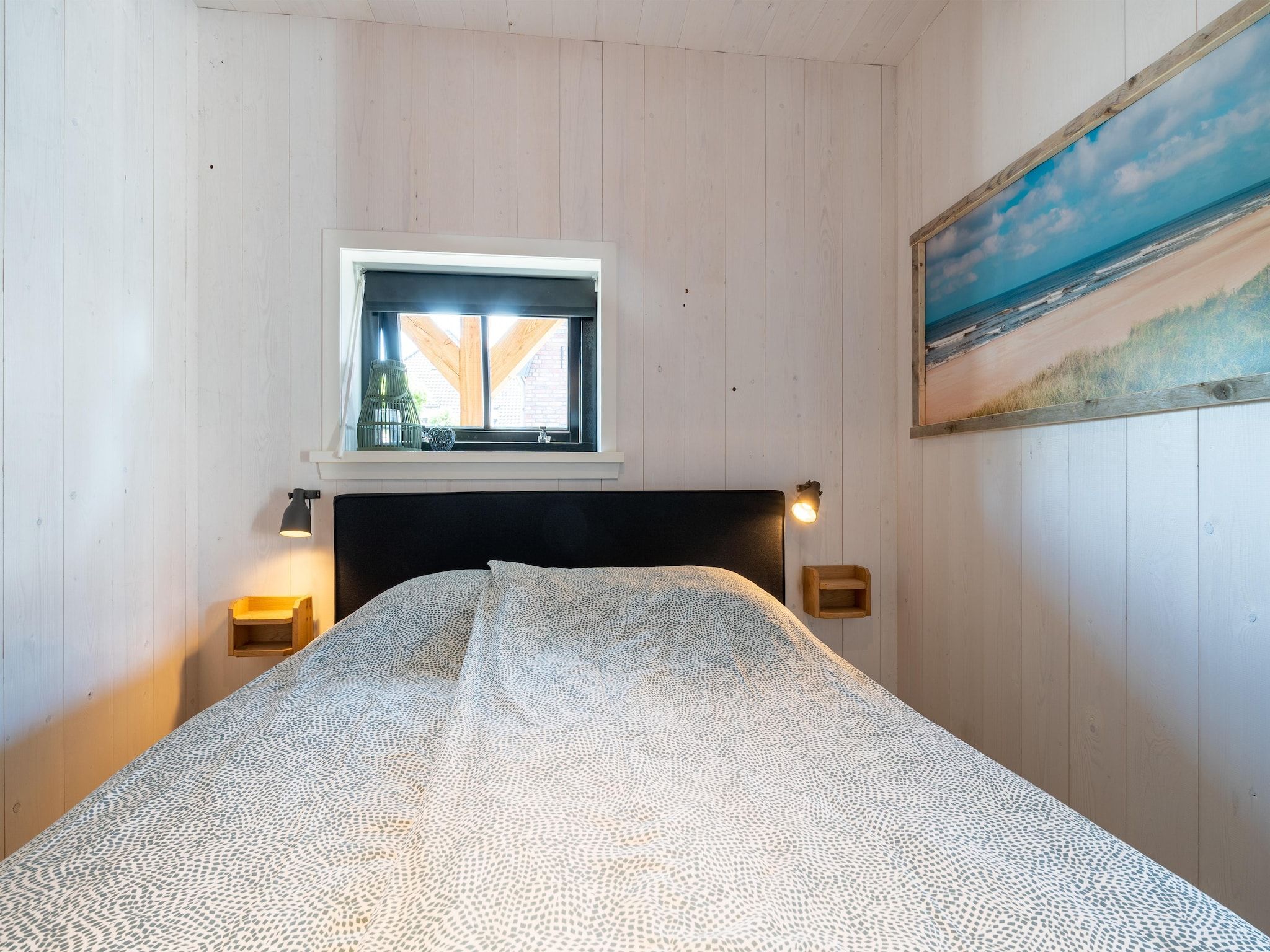 Een slaapkamer van Hazenborgh - Wagenboet in Callantsoog