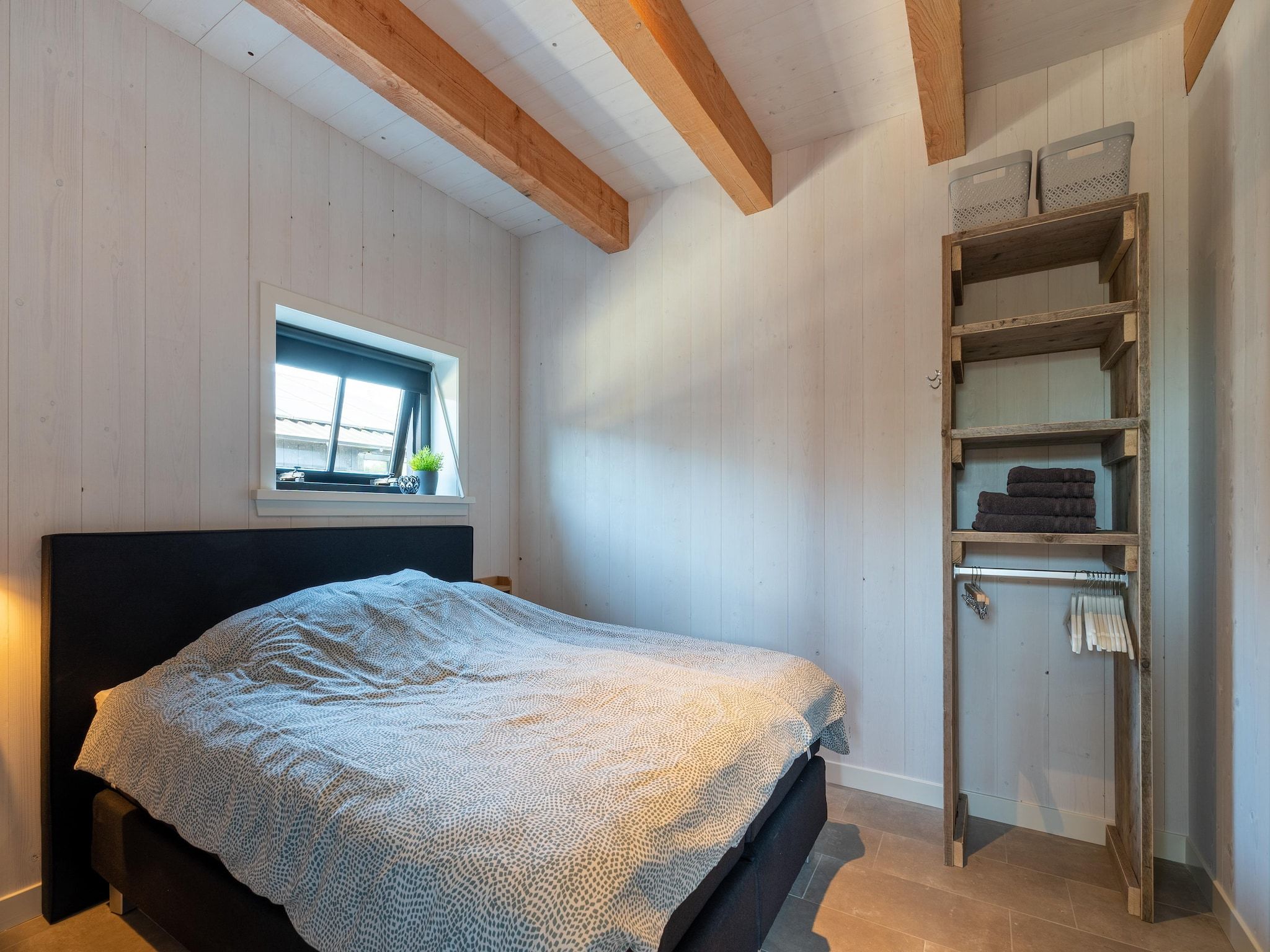 Een slaapkamer van Hazenborgh - Wagenboet in Callantsoog