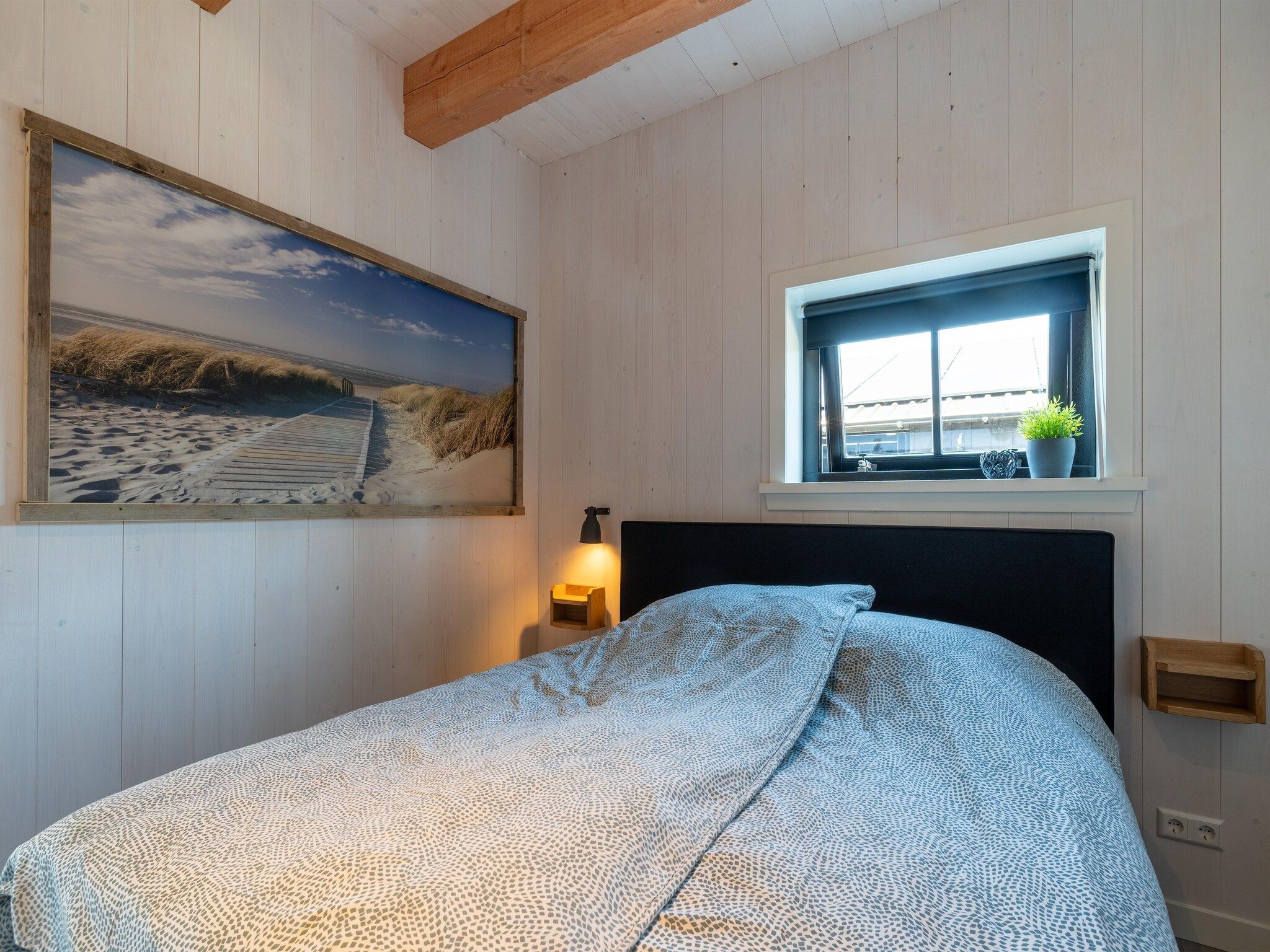 Een slaapkamer van Hazenborgh - Wagenboet in Callantsoog