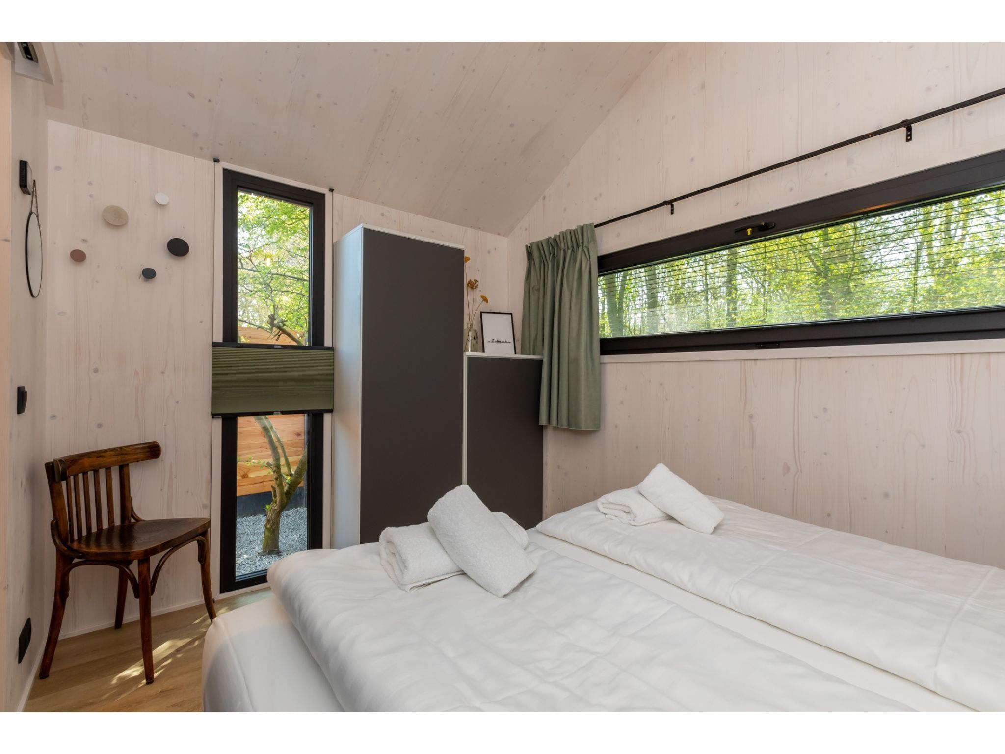 Een slaapkamer van Tinyhouse La Mouette in Zoutelande