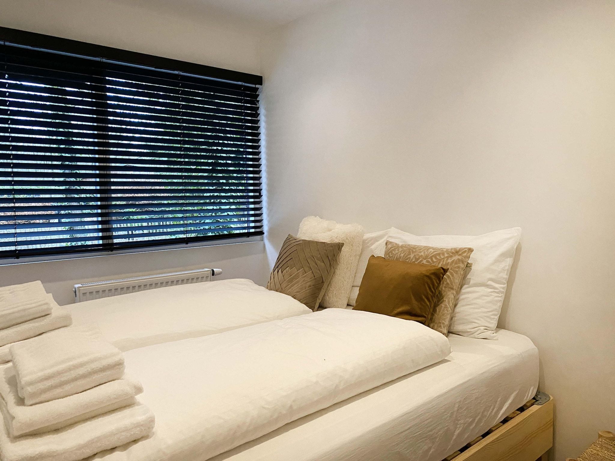 Een slaapkamer van Dutch Cabin Houses 45 in Rheezerveen