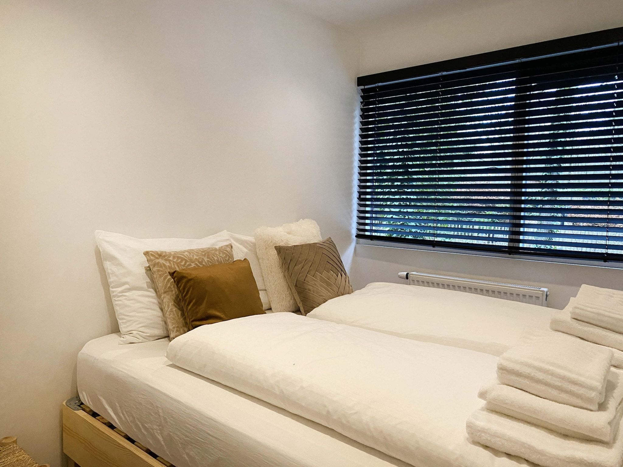 Een slaapkamer van Dutch Cabin Houses 45 in Rheezerveen