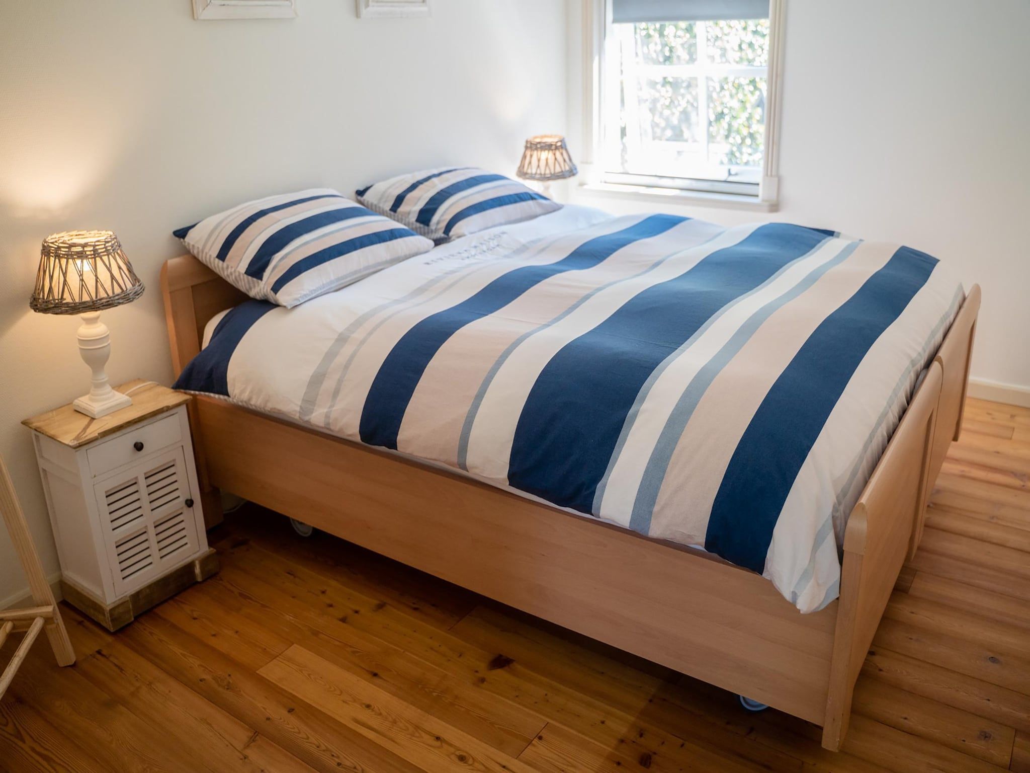 Een slaapkamer van Wad'n Leven en Geluk in Paesens