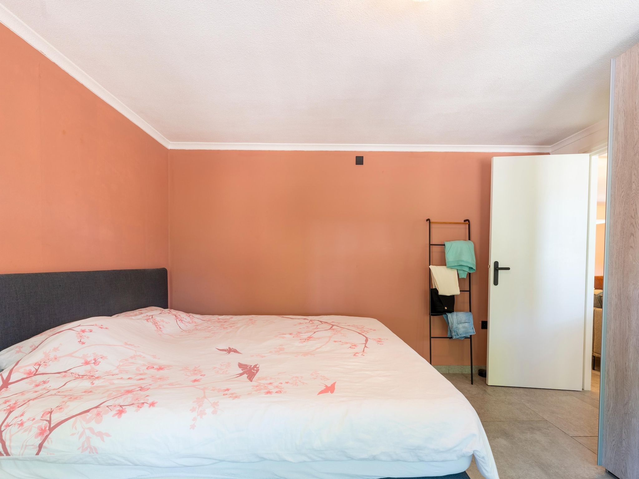 Een slaapkamer van Vakantiewoning de Zwaluw in Eibergen