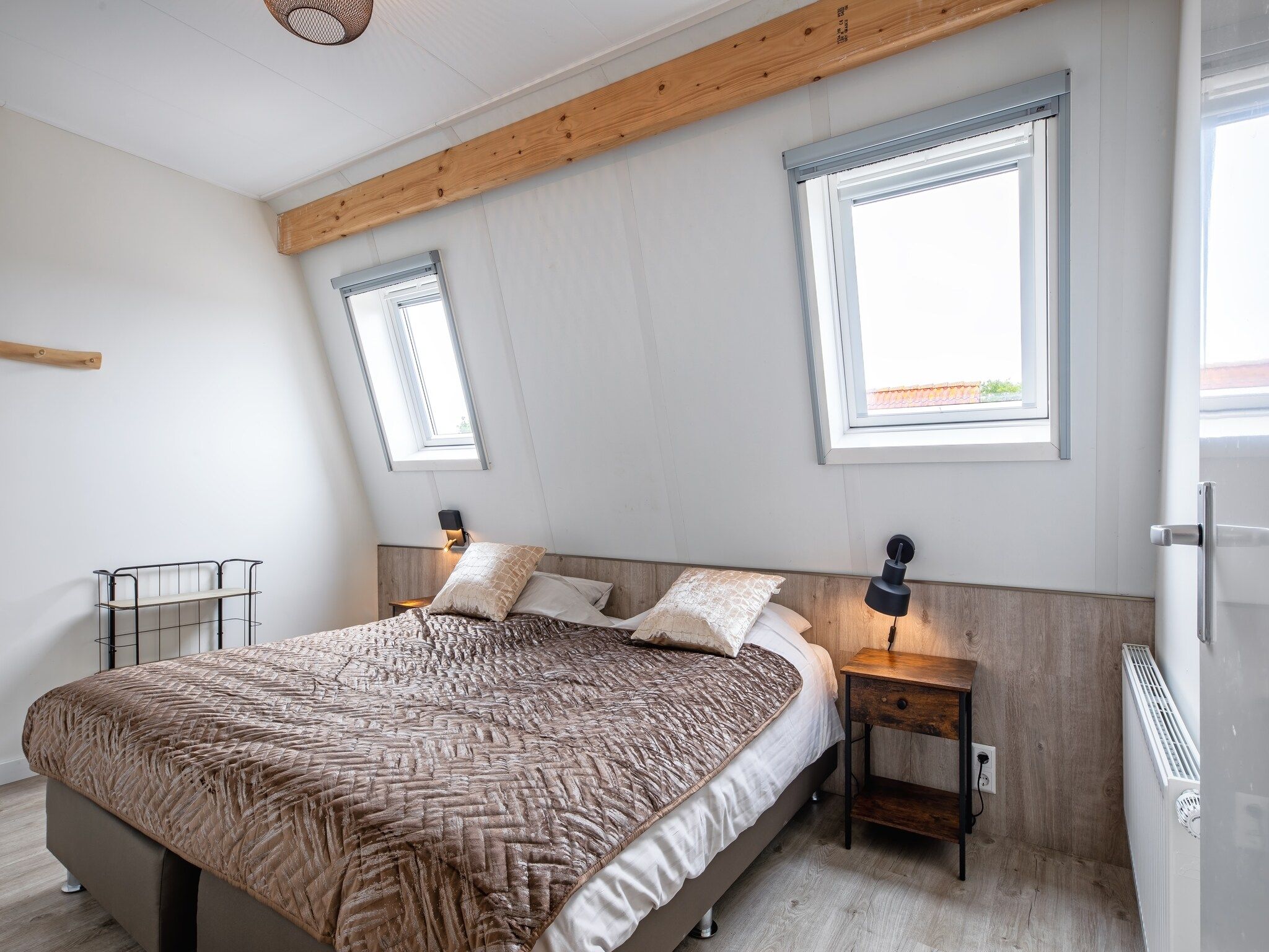 Een slaapkamer van Wulpenweid 10 in Den Burg