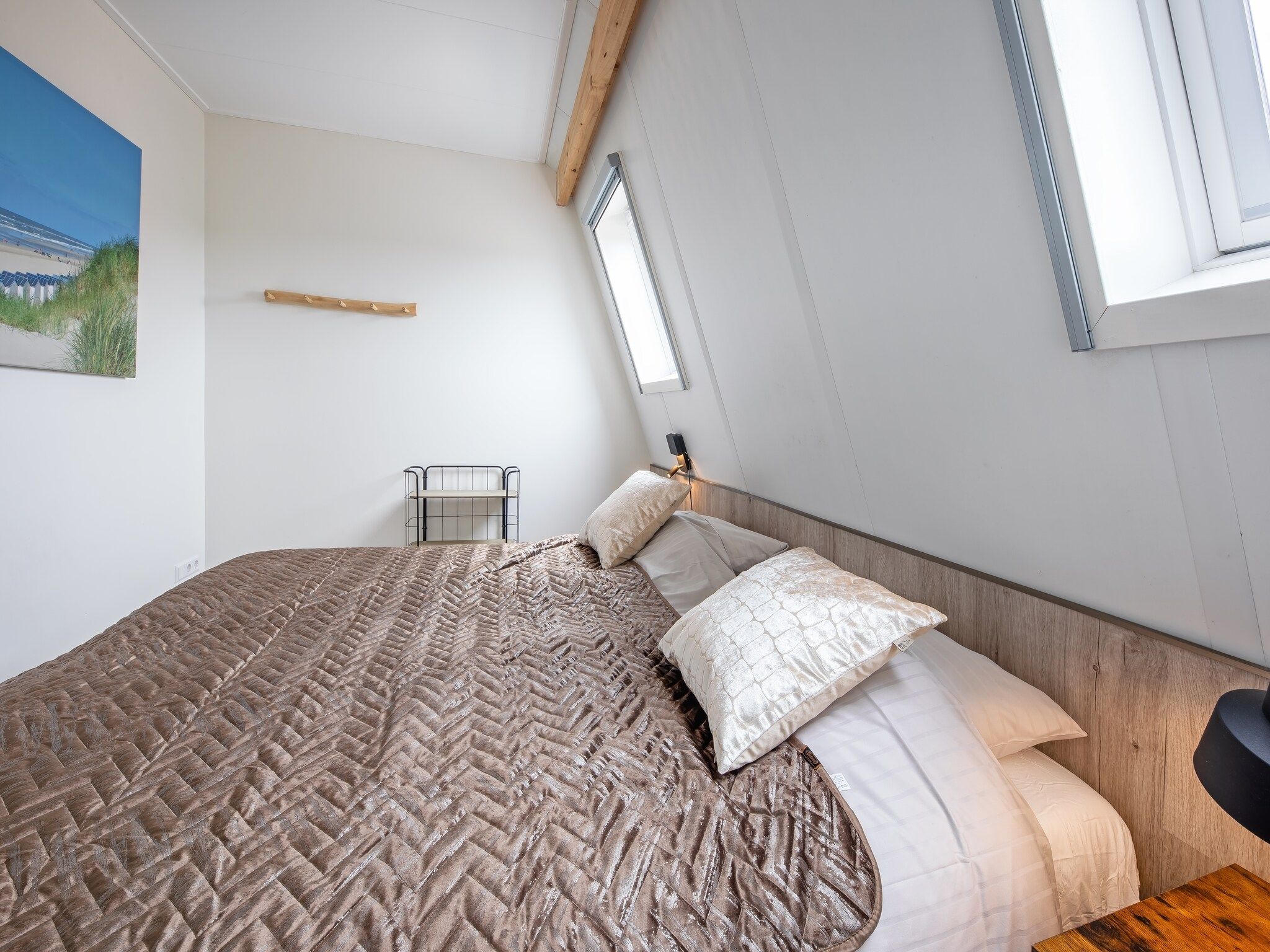 Een slaapkamer van Wulpenweid 10 in Den Burg