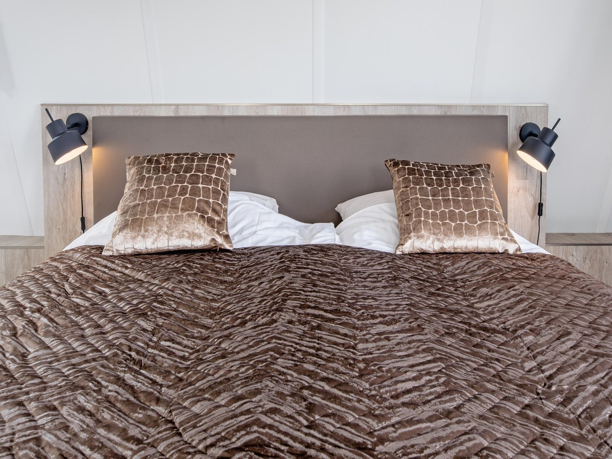 Een slaapkamer van Wulpenweid 10 in Den Burg