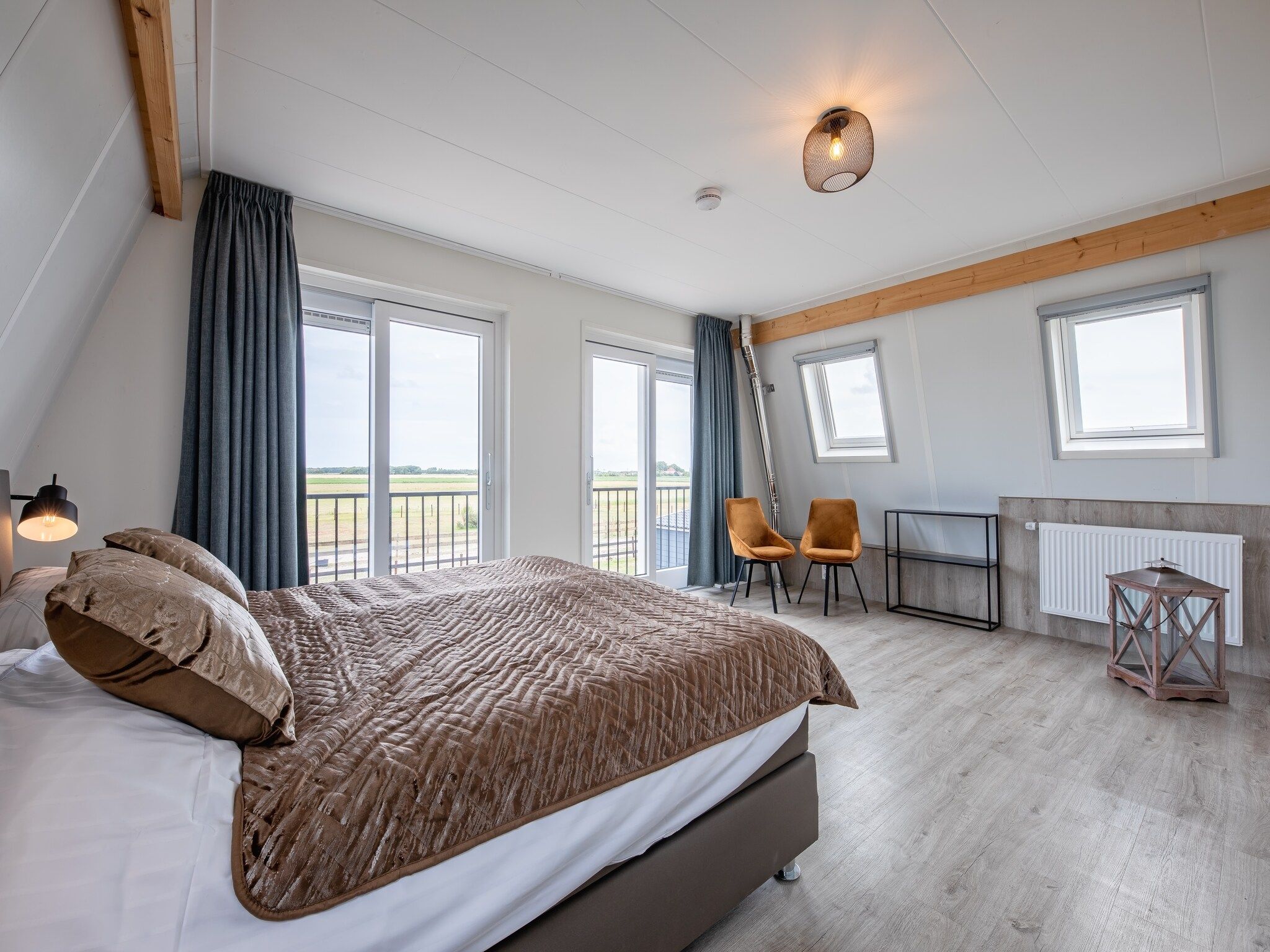 Een slaapkamer van Wulpenweid 10 in Den Burg