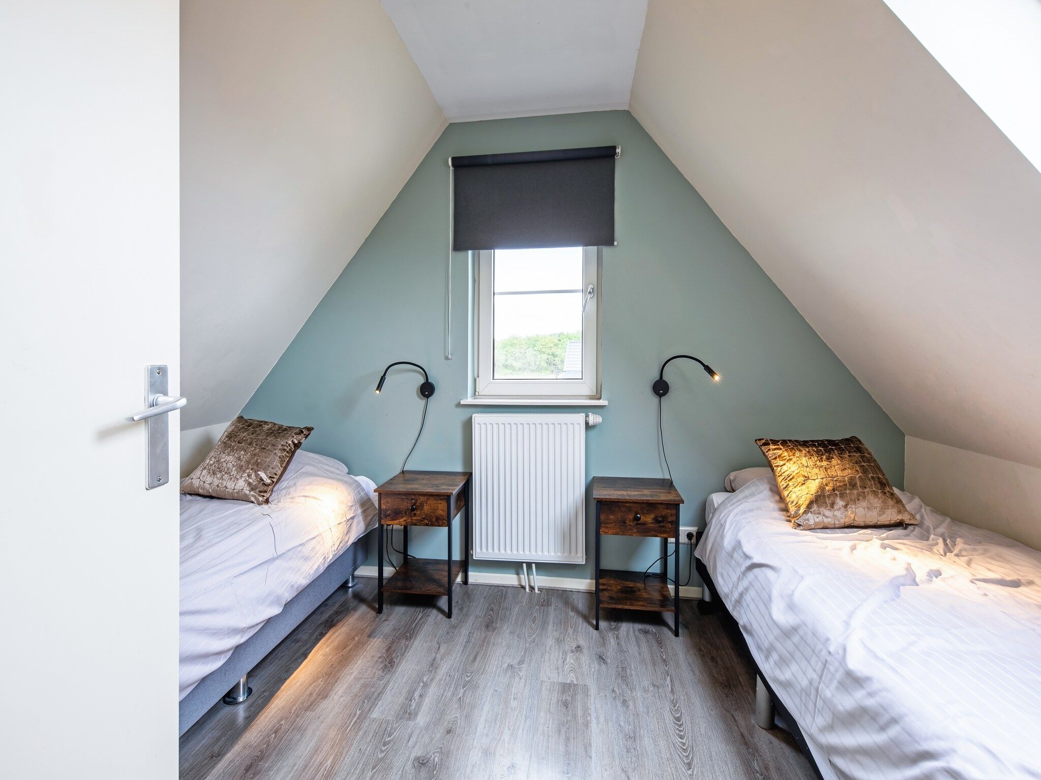 Een slaapkamer van Wulpenweid 12 in Den Burg