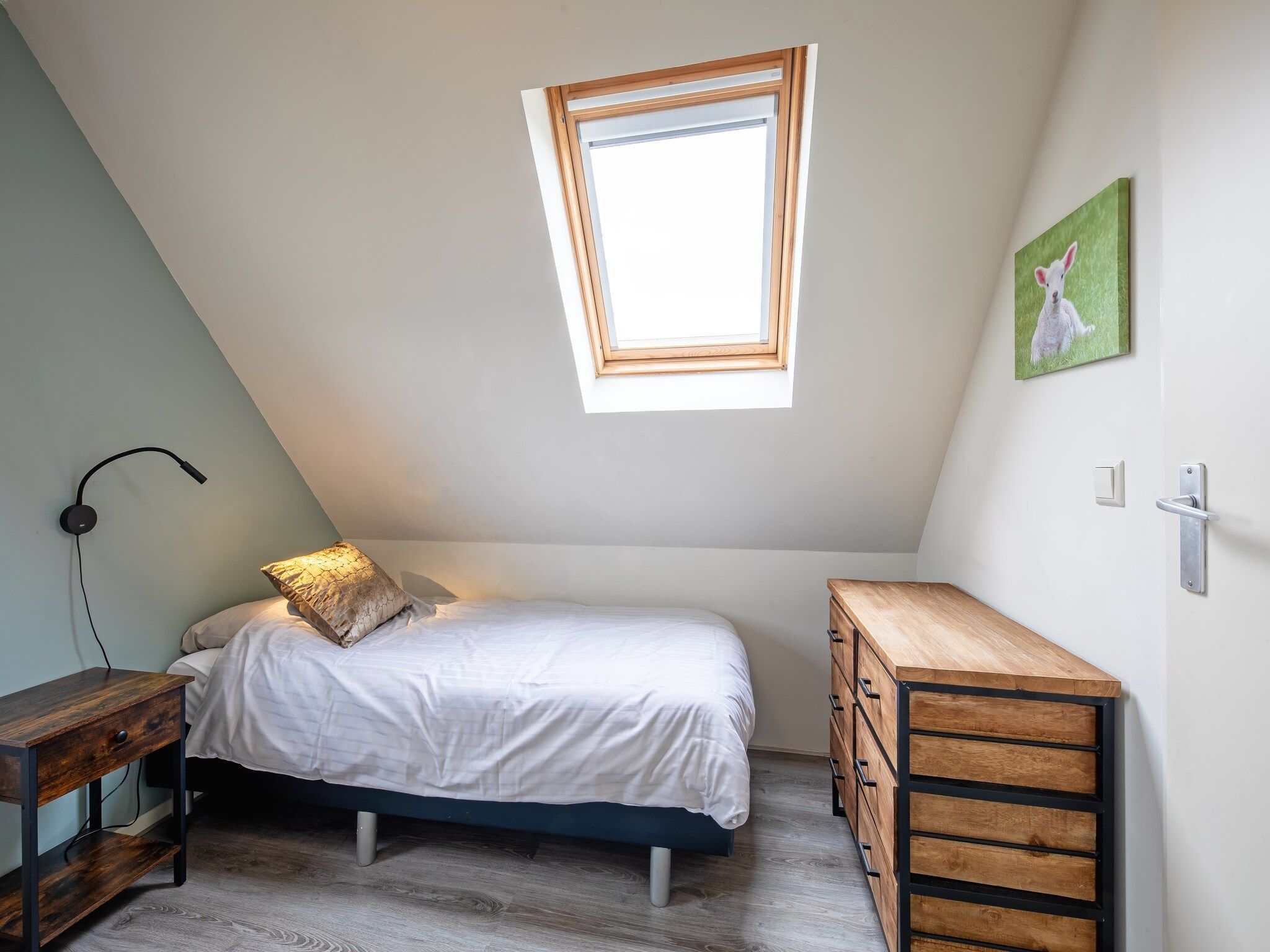 Een slaapkamer van Wulpenweid 12 in Den Burg