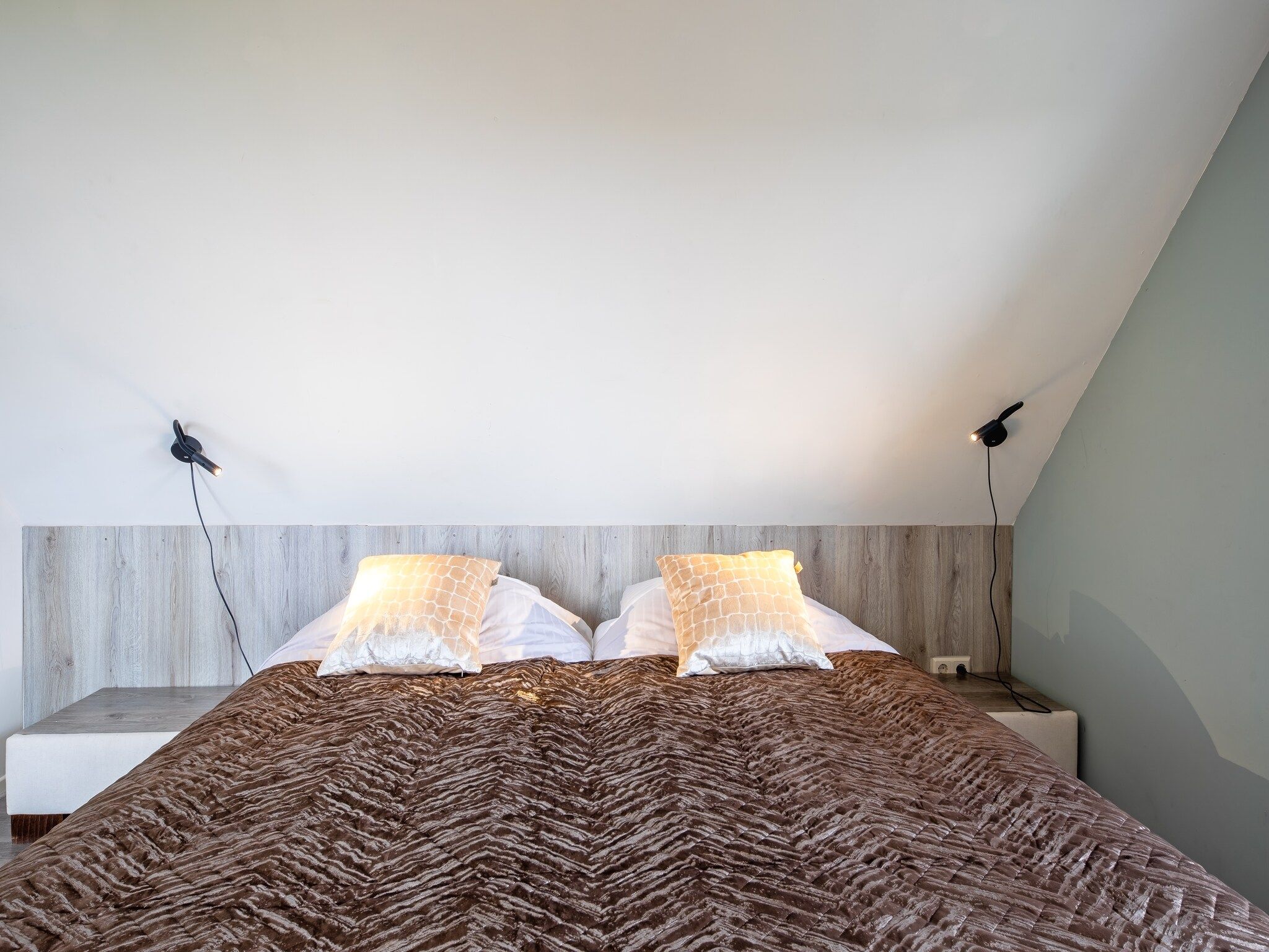 Een slaapkamer van Wulpenweid 12 in Den Burg