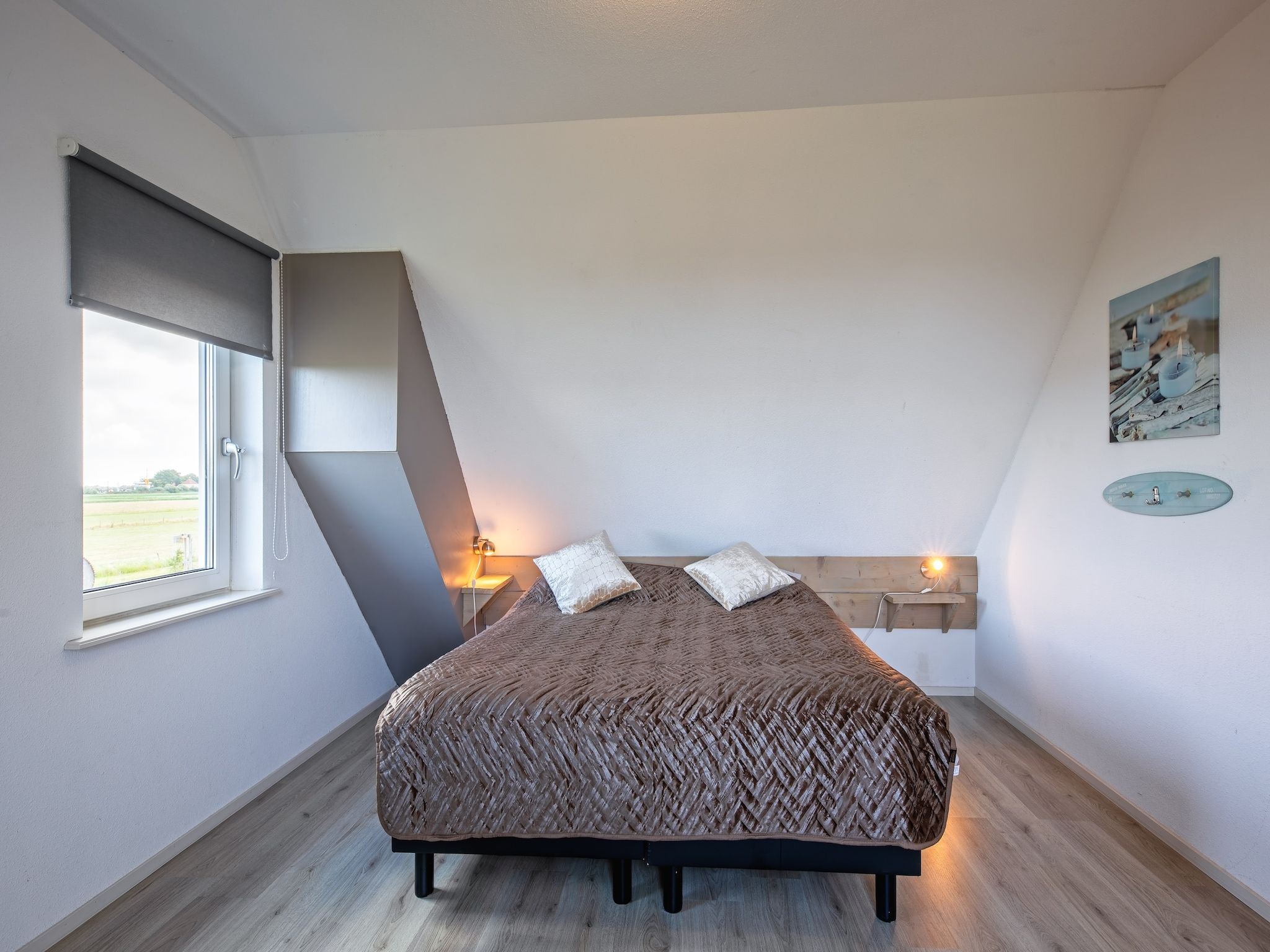 Een slaapkamer van Wulpenweid 12A in Den Burg