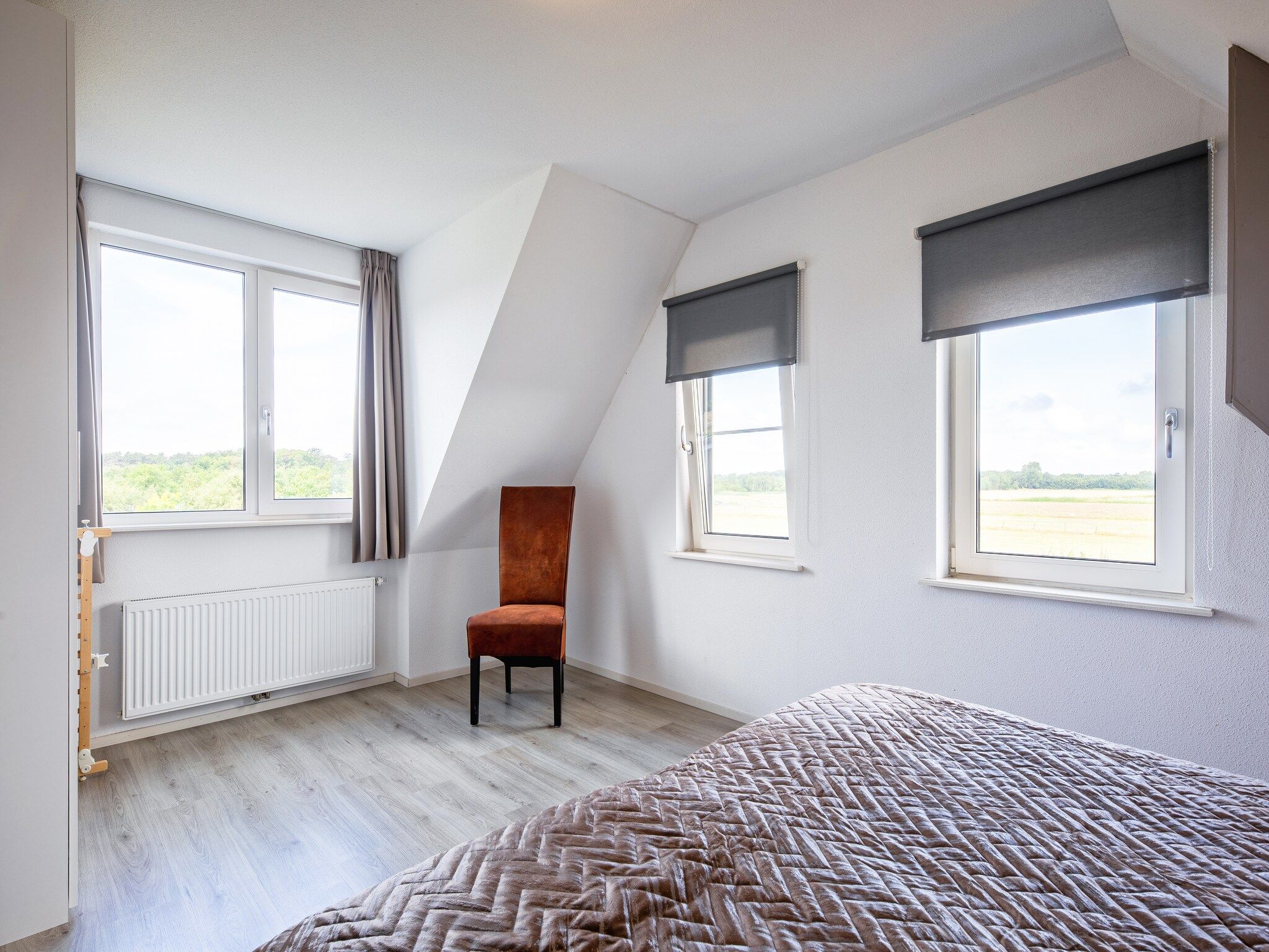 Een slaapkamer van Wulpenweid 12A in Den Burg