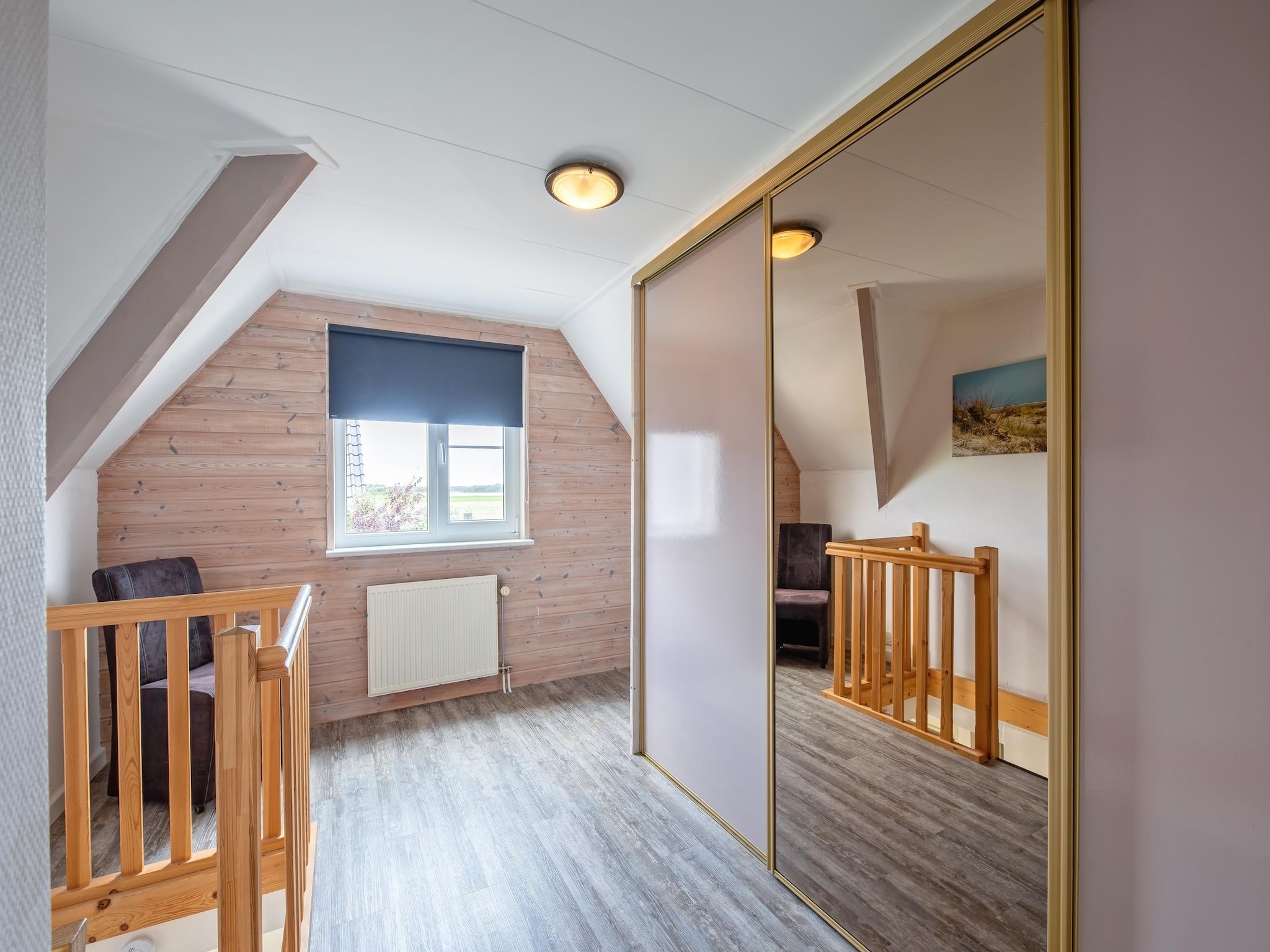 Een slaapkamer van Wulpenweid 14 in Den Burg