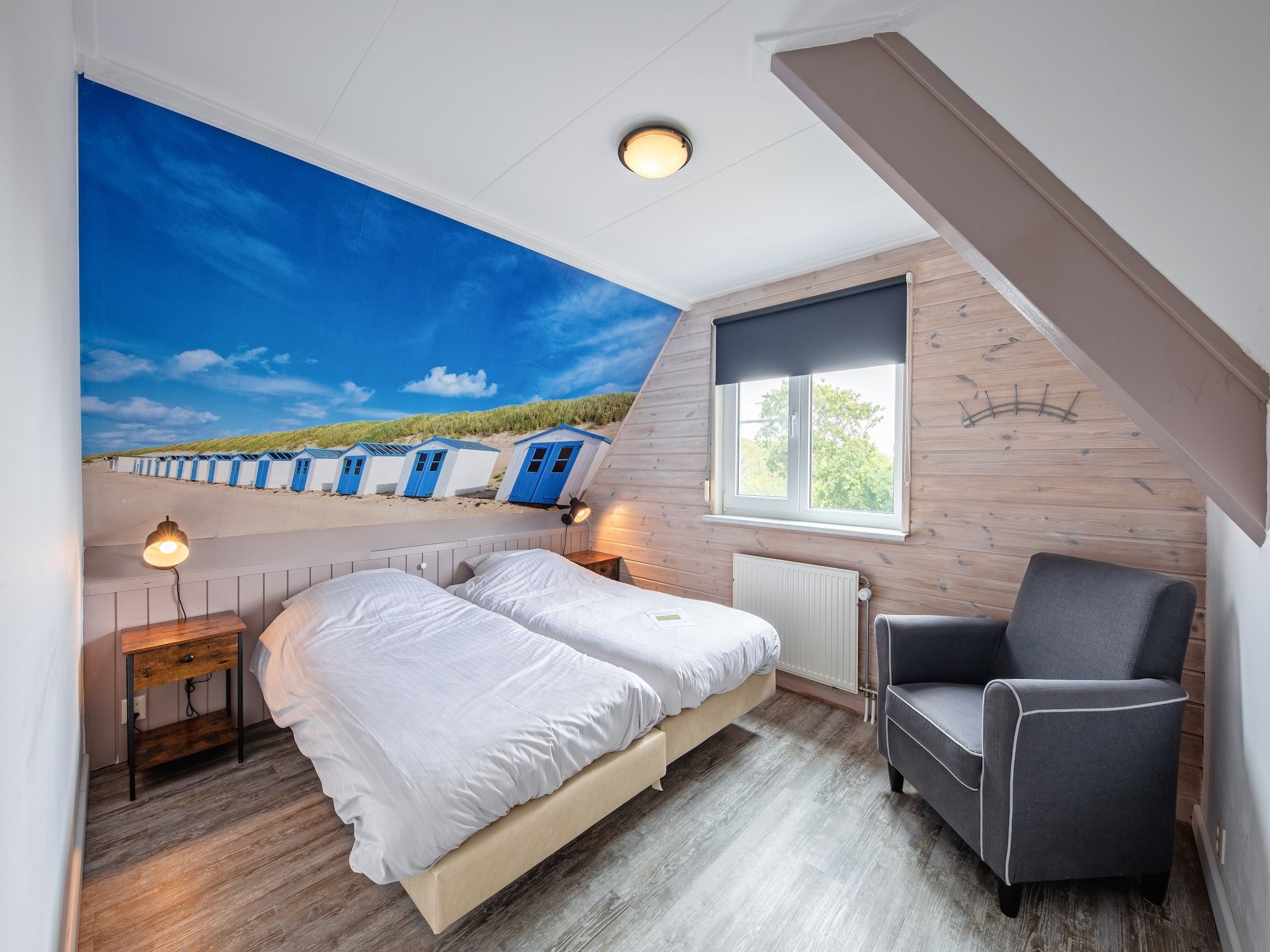 Een slaapkamer van Wulpenweid 14 in Den Burg