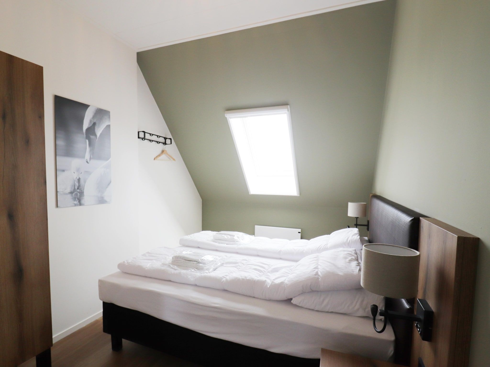 Een slaapkamer van Friese Villa - 6 persoons met sloep optioneel bij te boeken in Leons