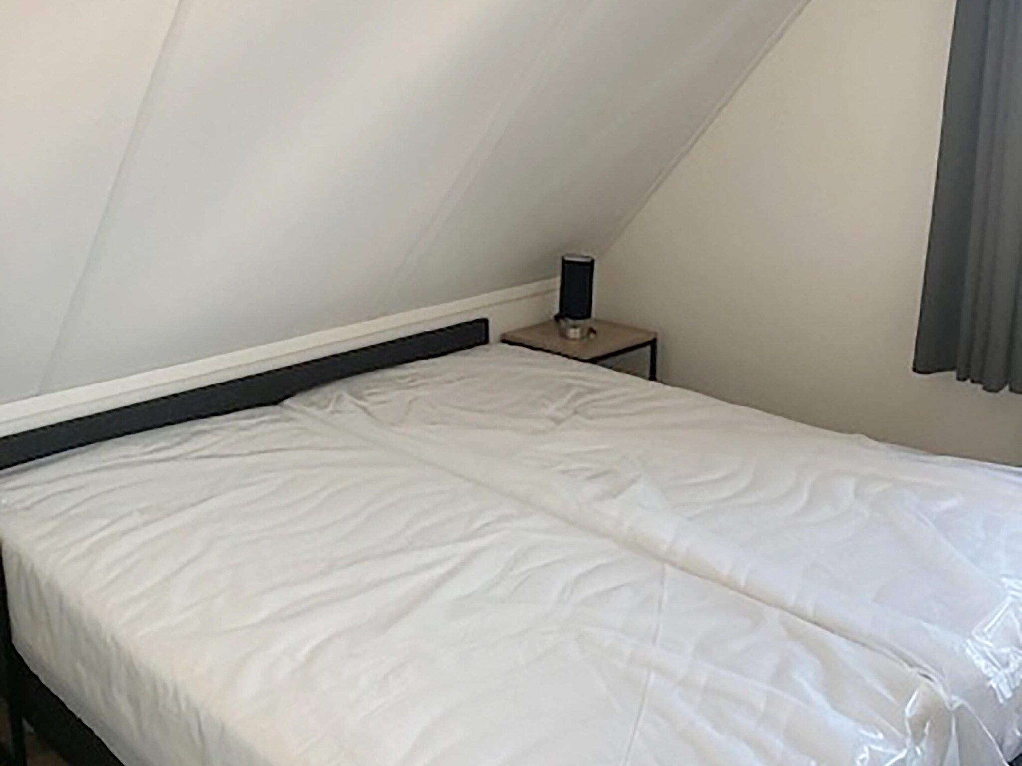 Een slaapkamer van Kuifduiker 124 in Simonshaven