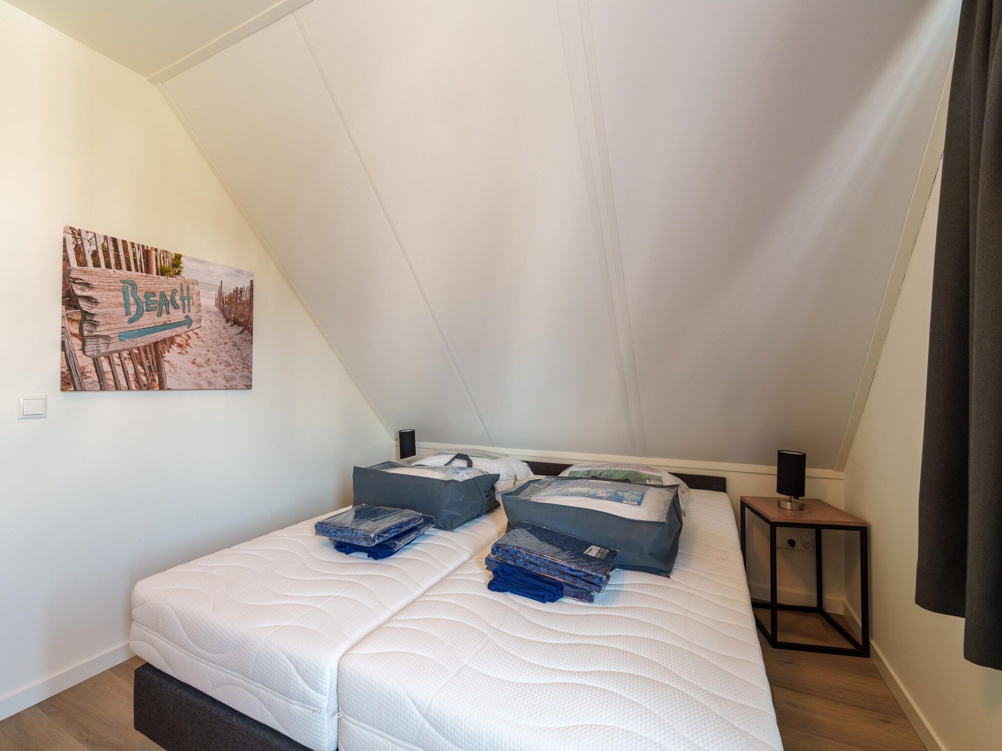 Een slaapkamer van Kuifduiker 124 in Simonshaven