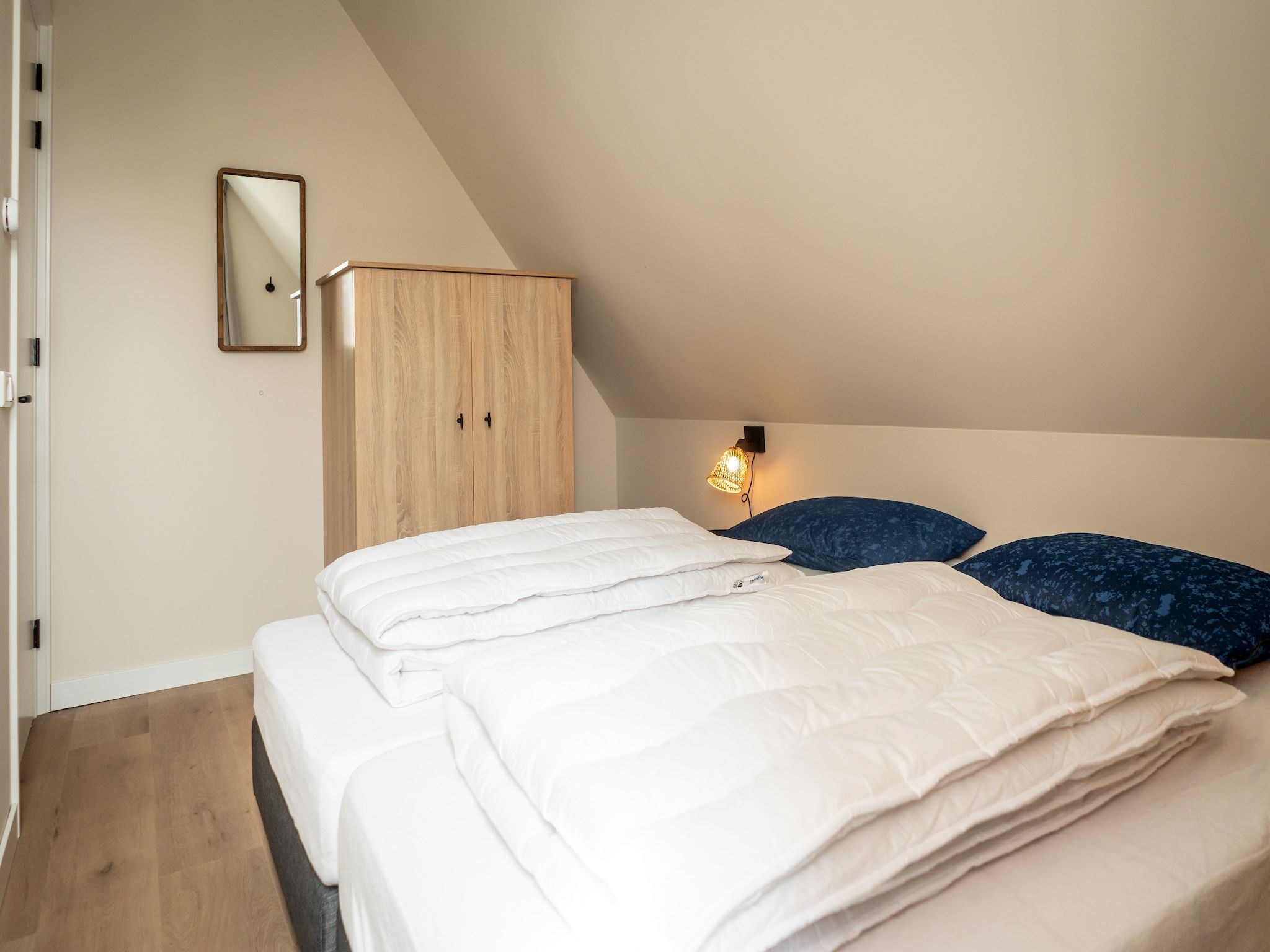 Een slaapkamer van So What 25a in De Koog