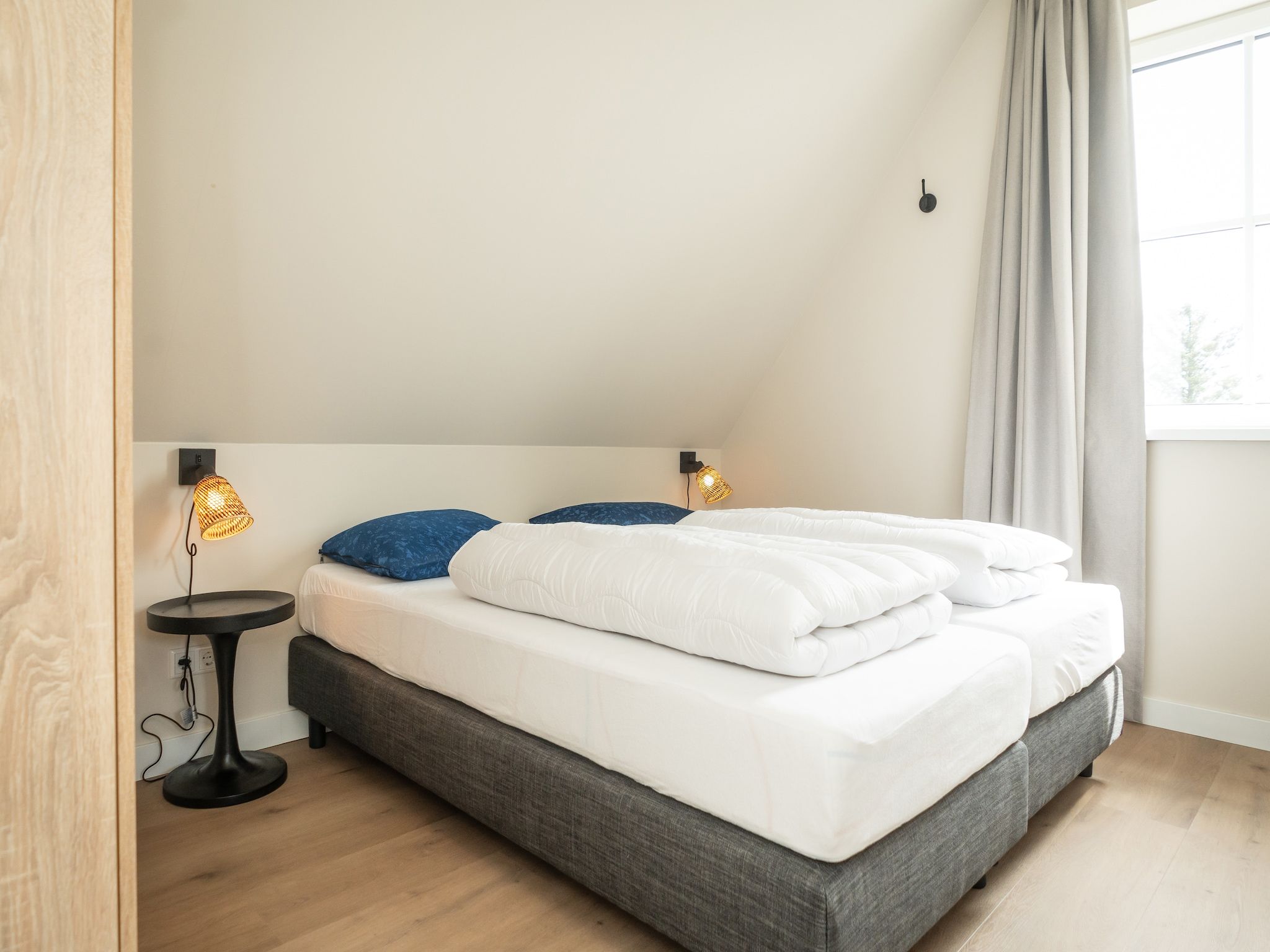 Een slaapkamer van So What 33A in De Koog