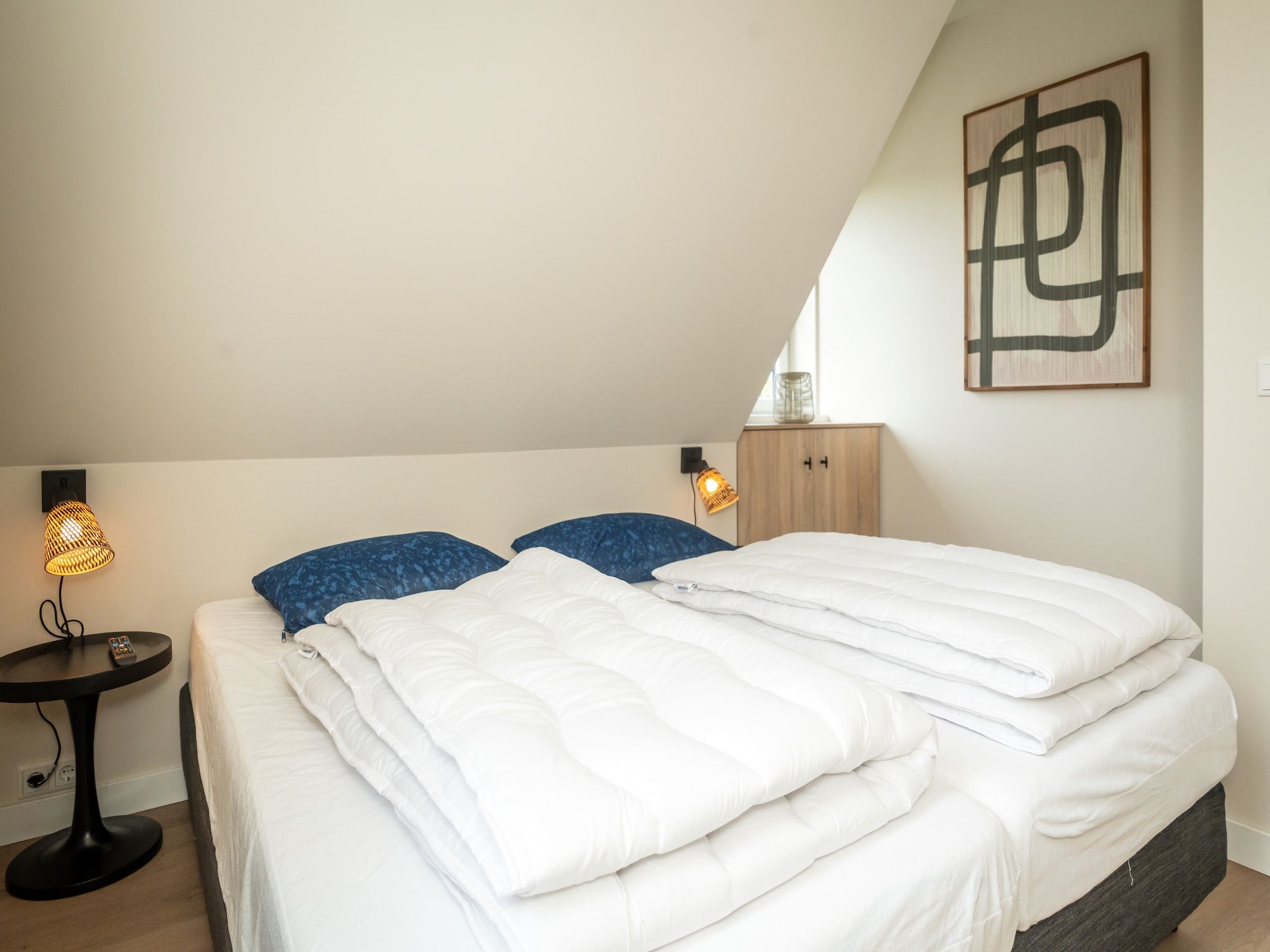 Een slaapkamer van So What 33A in De Koog