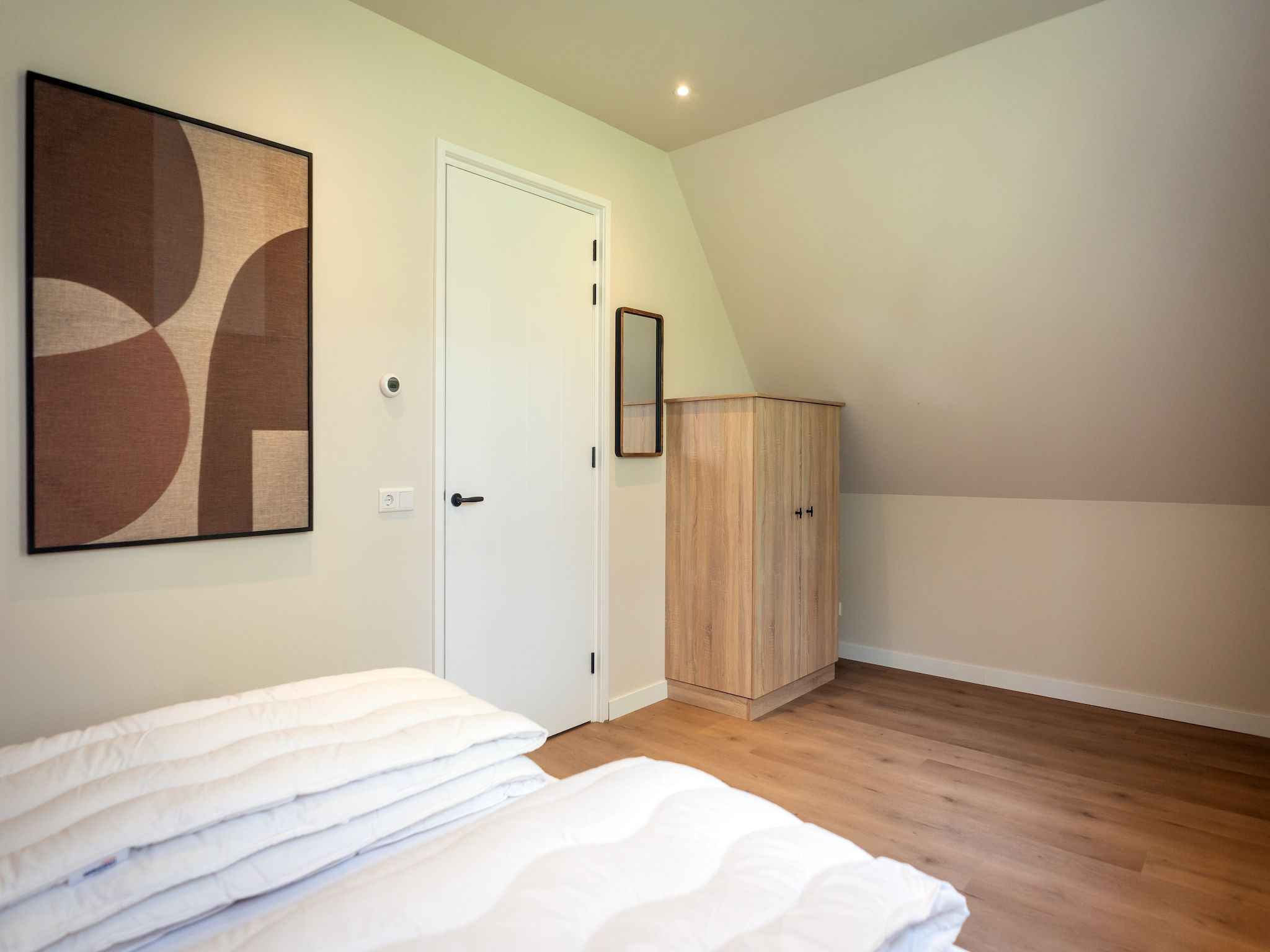 Een slaapkamer van So What 33A in De Koog