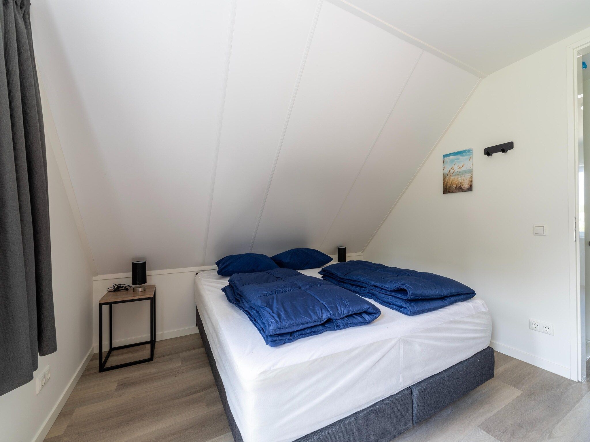 Een slaapkamer van Kuifduiker 5 in Simonshaven