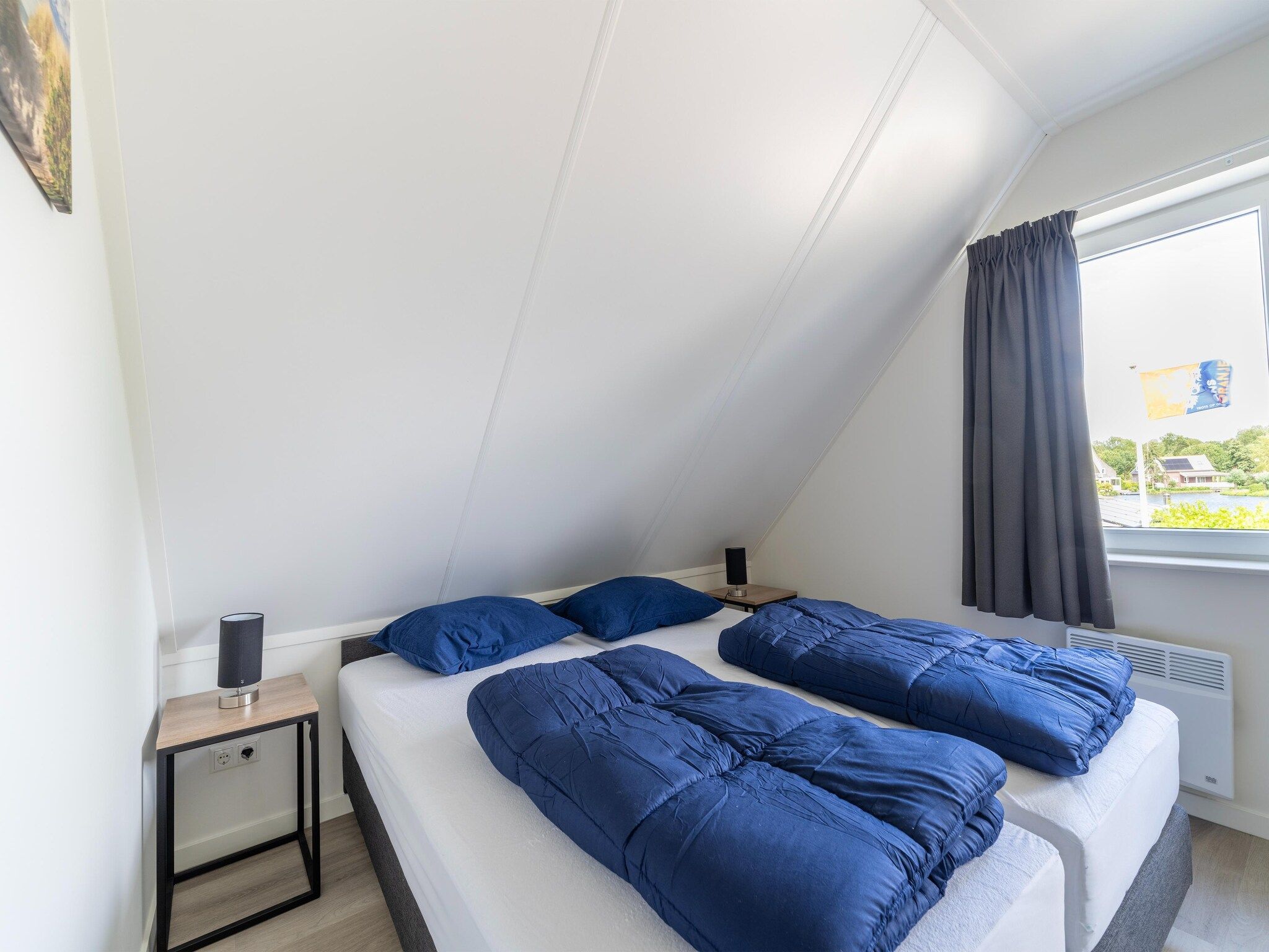 Een slaapkamer van Kuifduiker 5 in Simonshaven