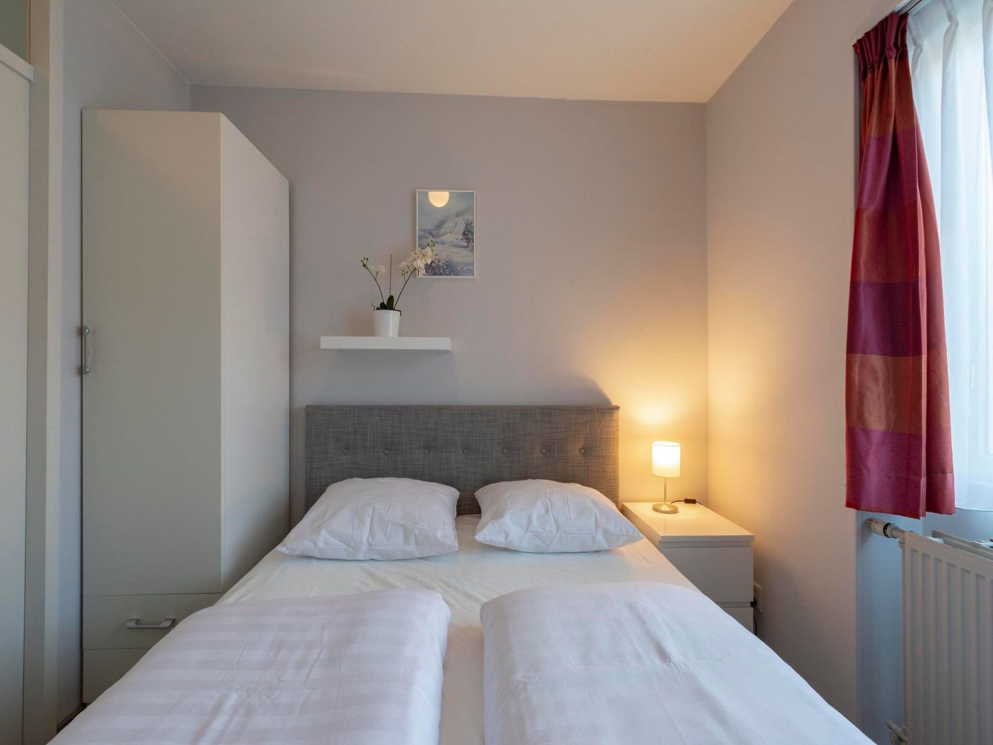 Een slaapkamer van Beach Appartement 08 in Callantsoog