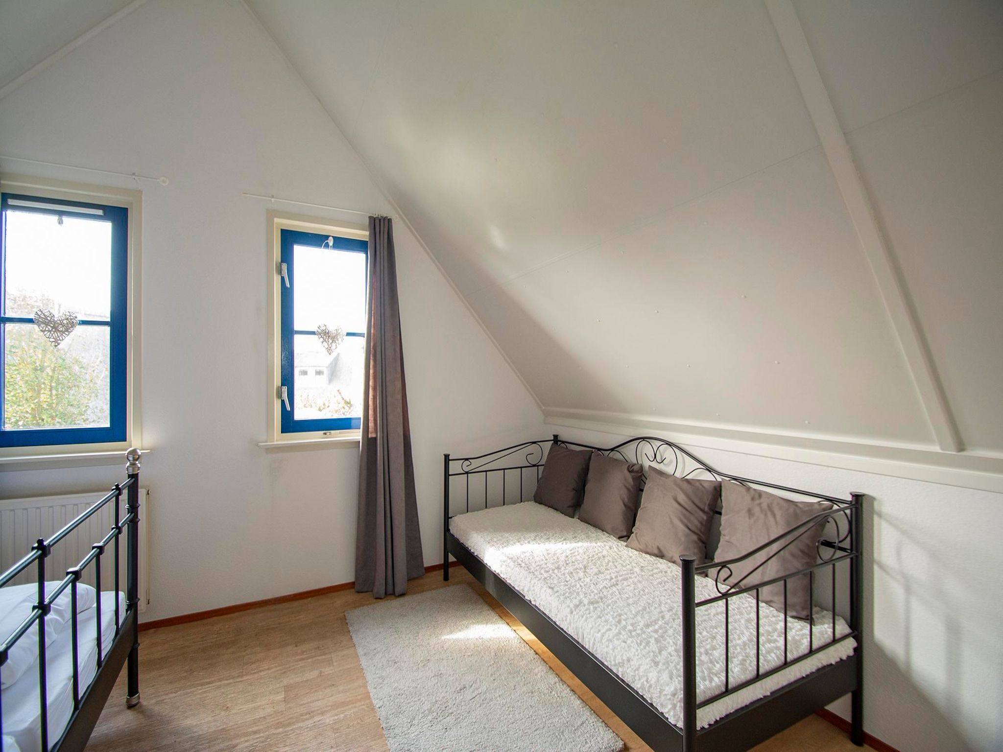 Een slaapkamer van De Buitenplaats 100 in Callantsoog