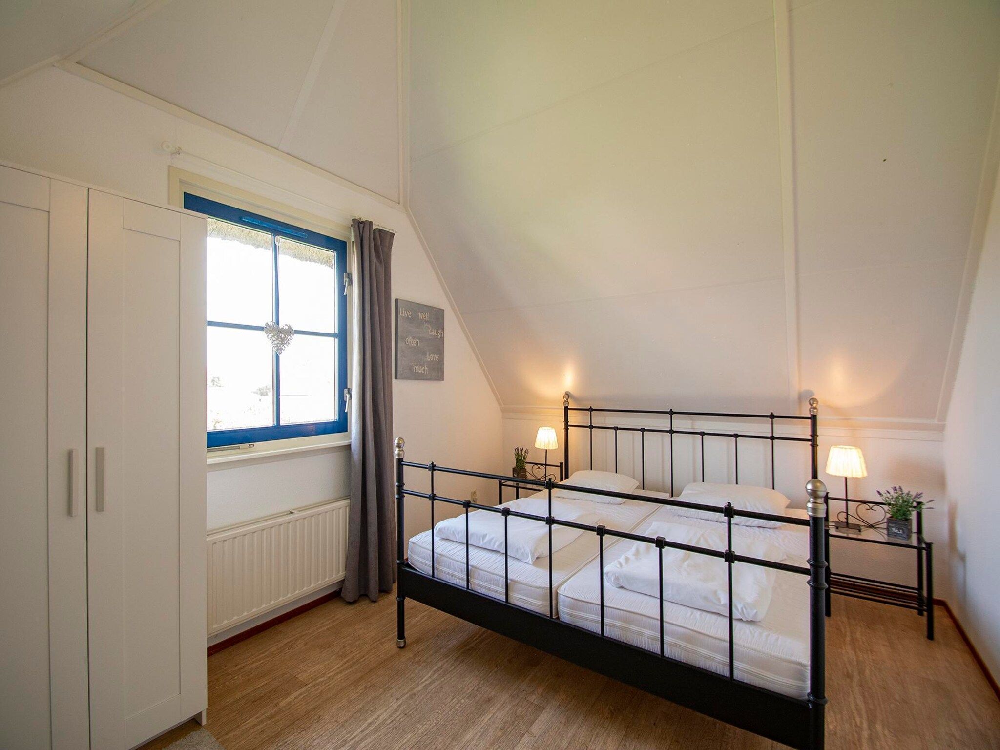 Een slaapkamer van De Buitenplaats 100 in Callantsoog