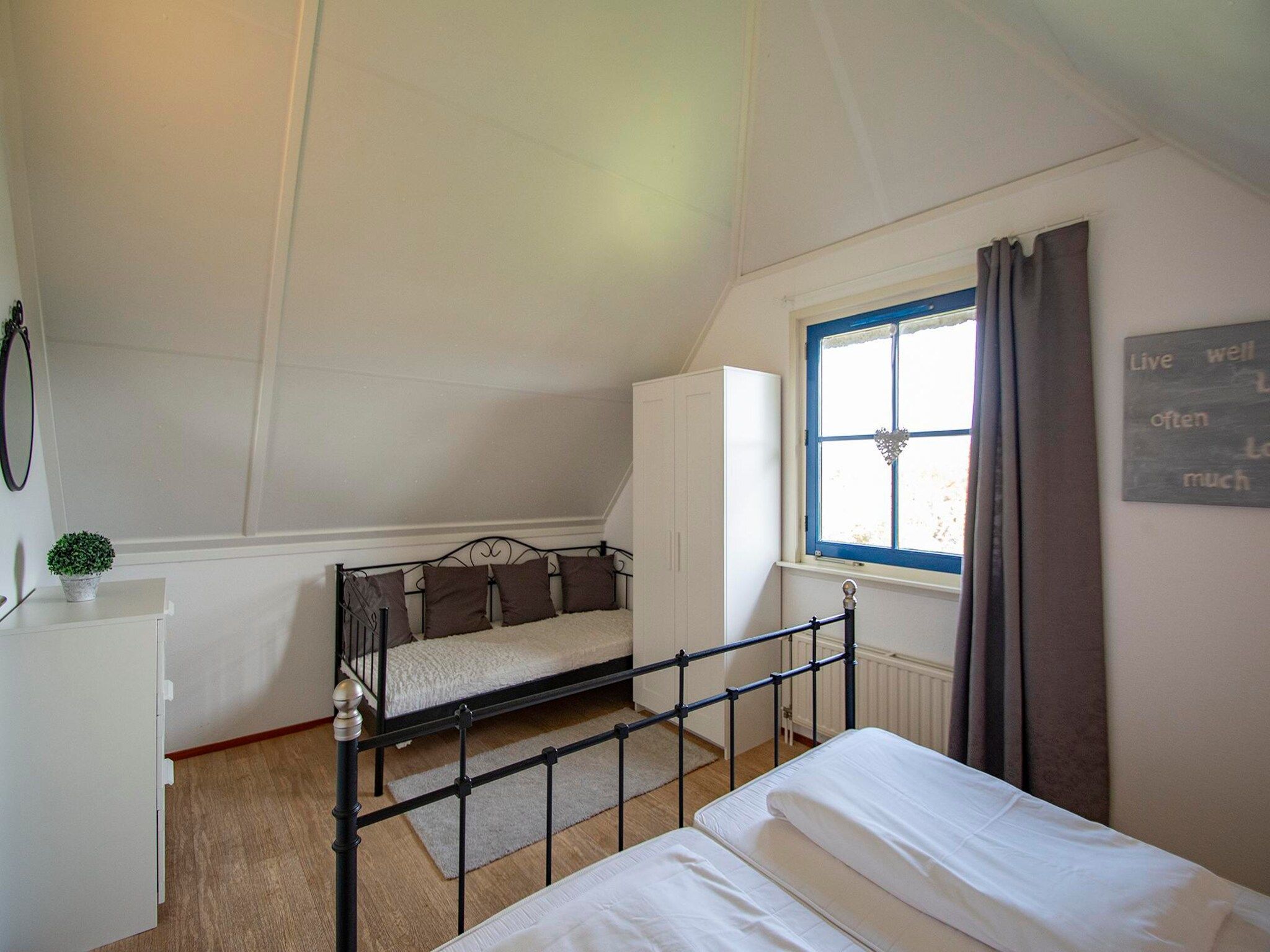 Een slaapkamer van De Buitenplaats 100 in Callantsoog