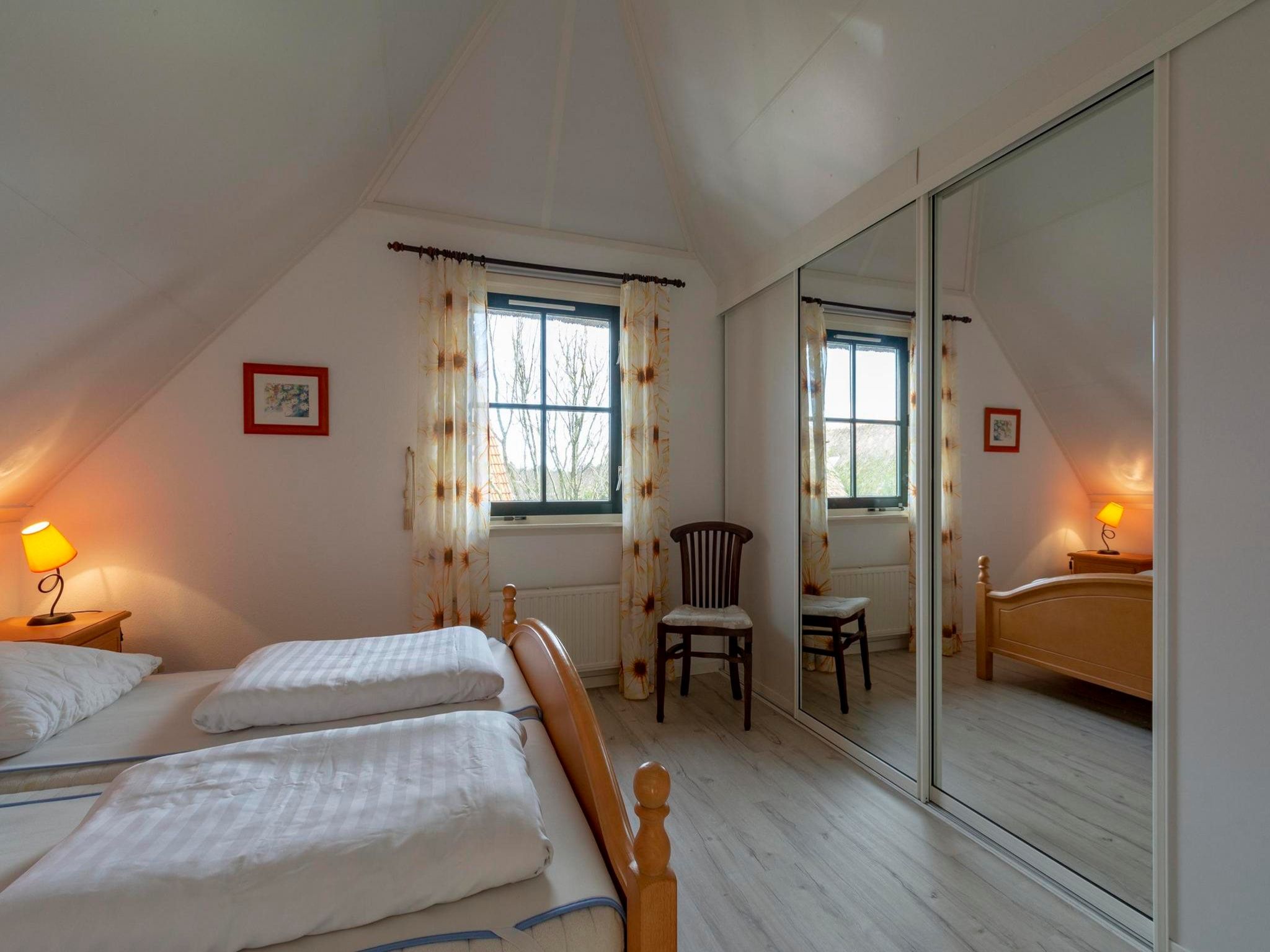 Een slaapkamer van De Buitenplaats 145 in Callantsoog