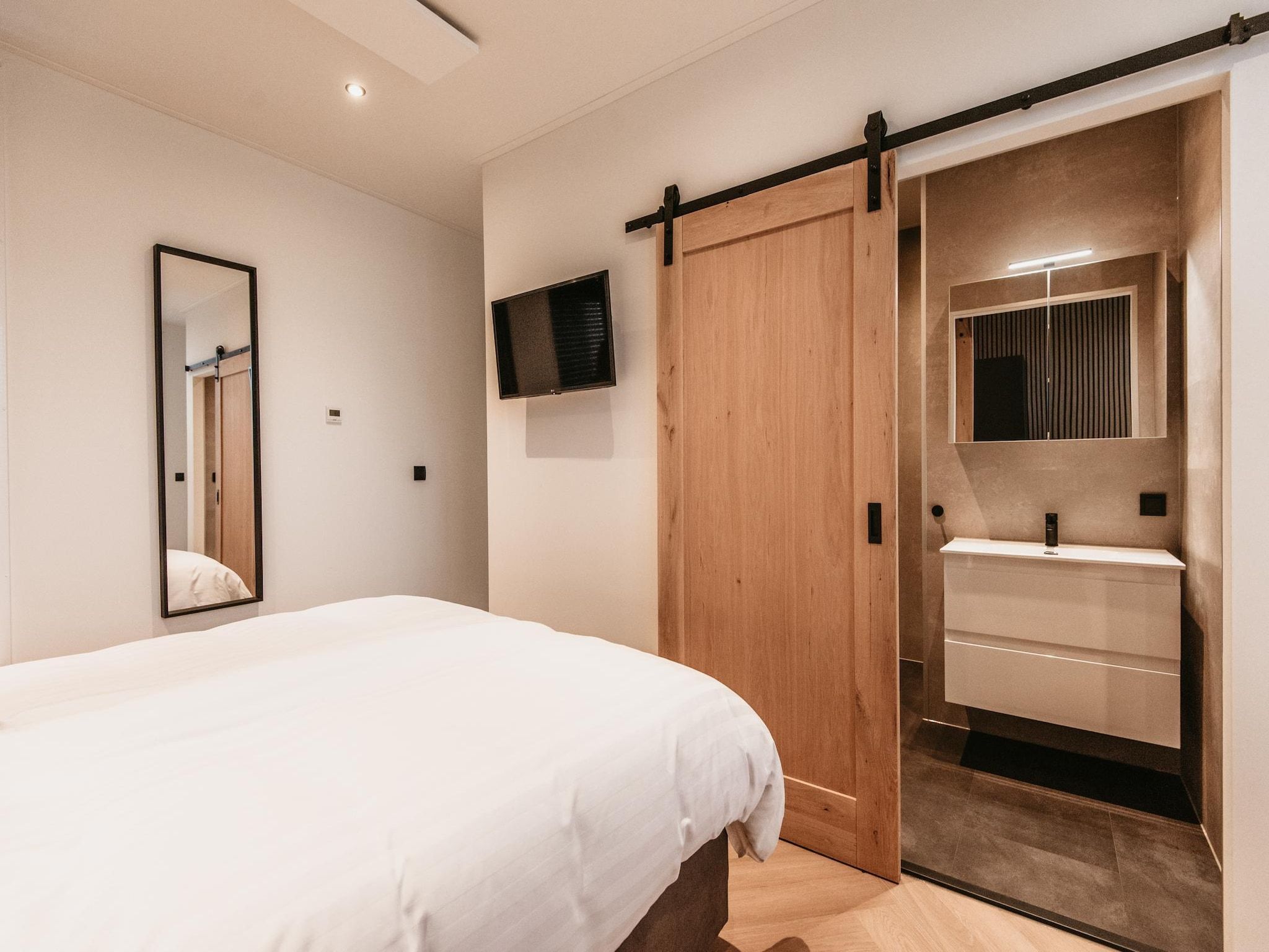 Een slaapkamer van Chalet aan het Water - Betuwse Hofjes - 4P in Kesteren