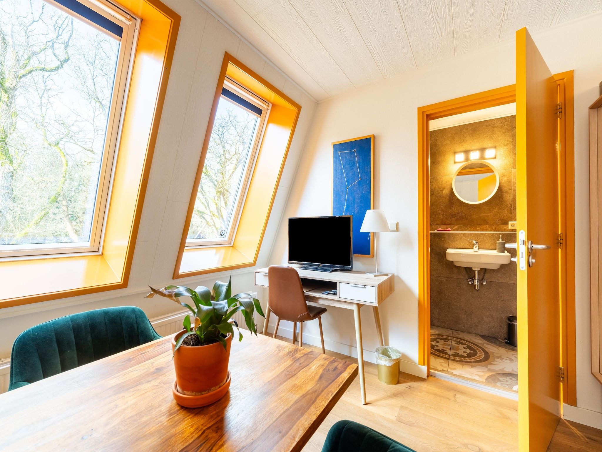 Een slaapkamer van Landhuis Hezenes in Diever